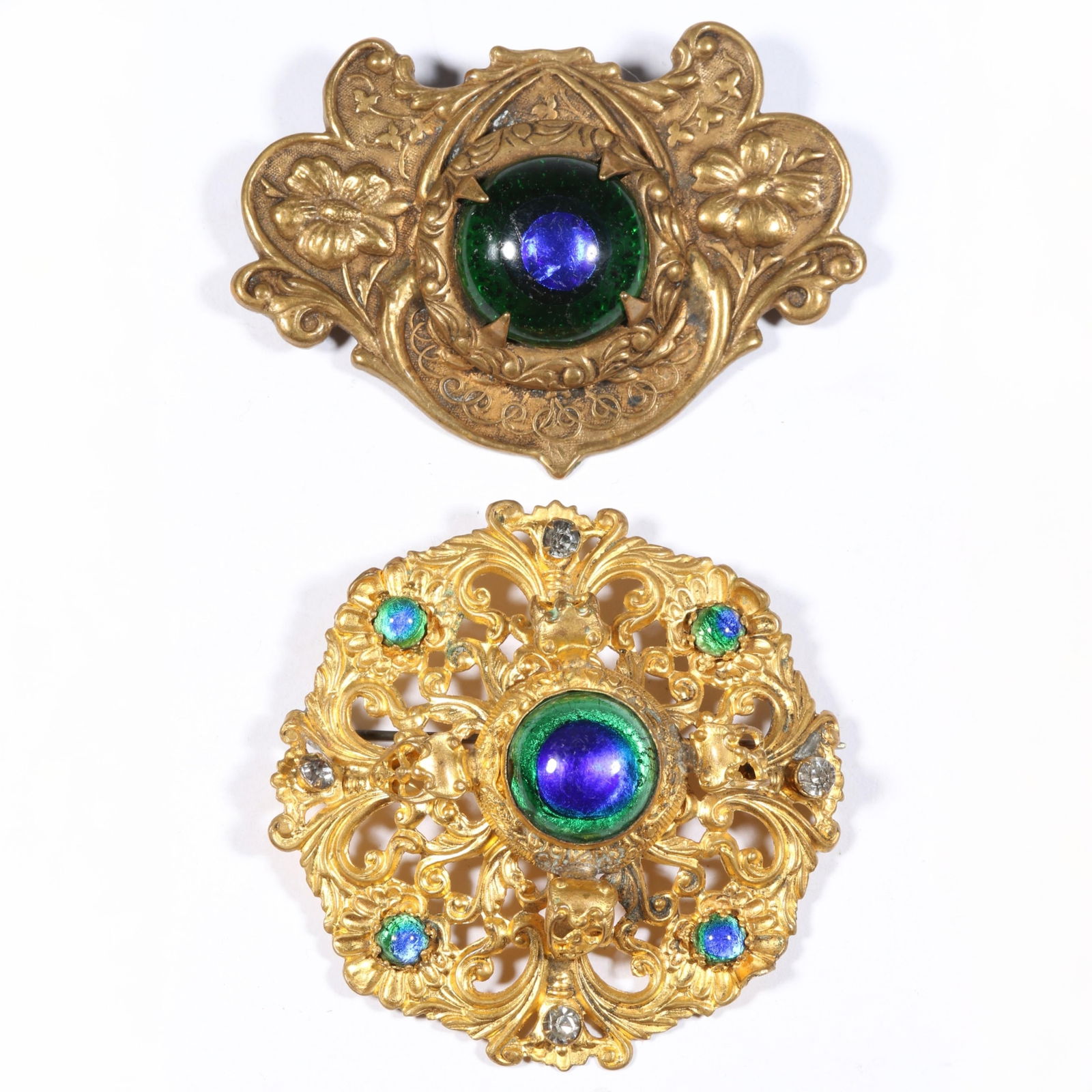 Pair of Antique peacock glass brooches. 2 1/8"Diameter (round brooch): Pair of Antique peacock glass brooches. Top brooch has damage to foil back glass. 2 1/8"Diameter (round brooch)