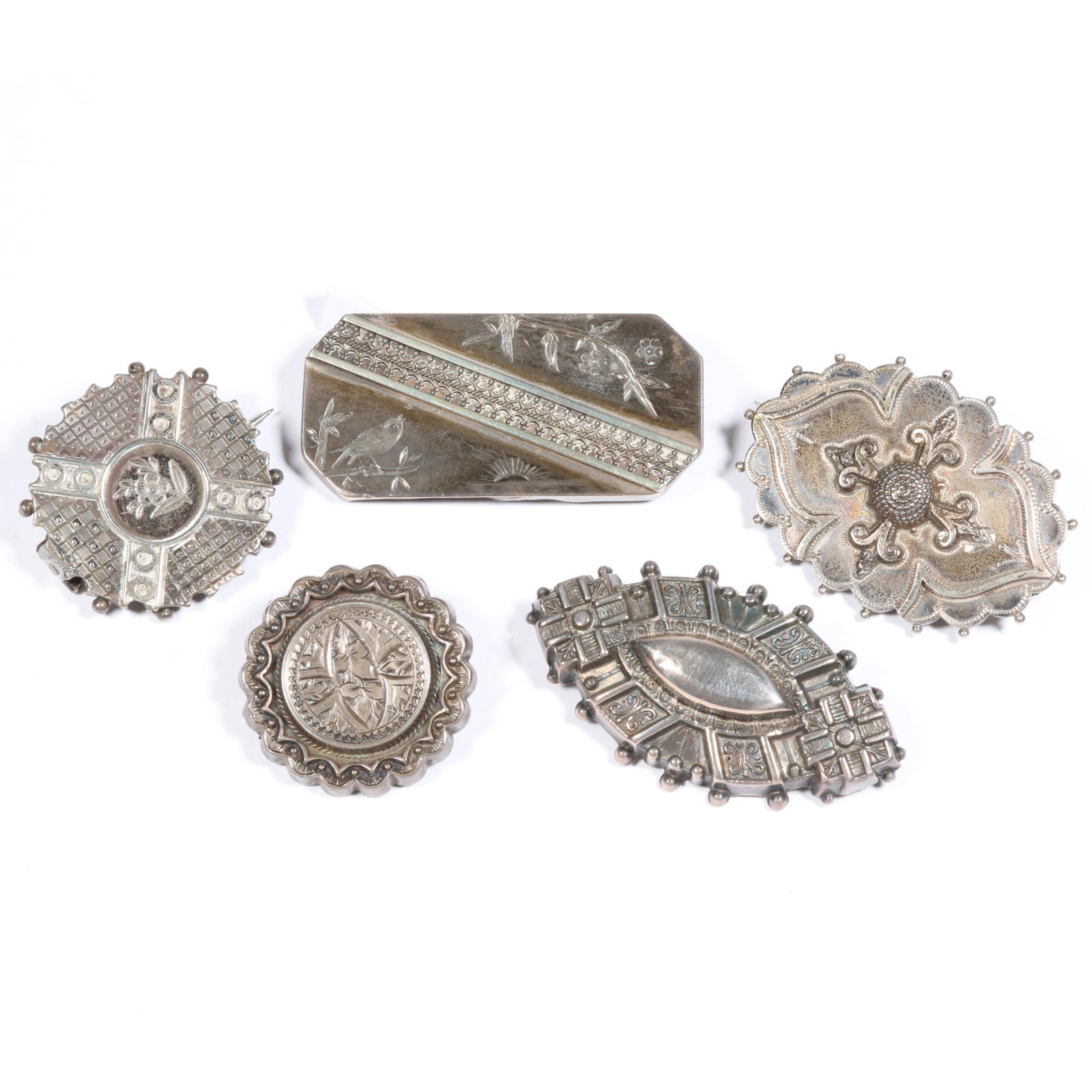 Victorian intricate engraved brooches with some sterling, marked and unmarked, and pair of lockets.: Victorian intricate engraved brooches with some sterling, marked and unmarked, and pair of lockets. One locket has wear to clasp. Provenance: From the collection of Sue Rudman, owner of Antique Source