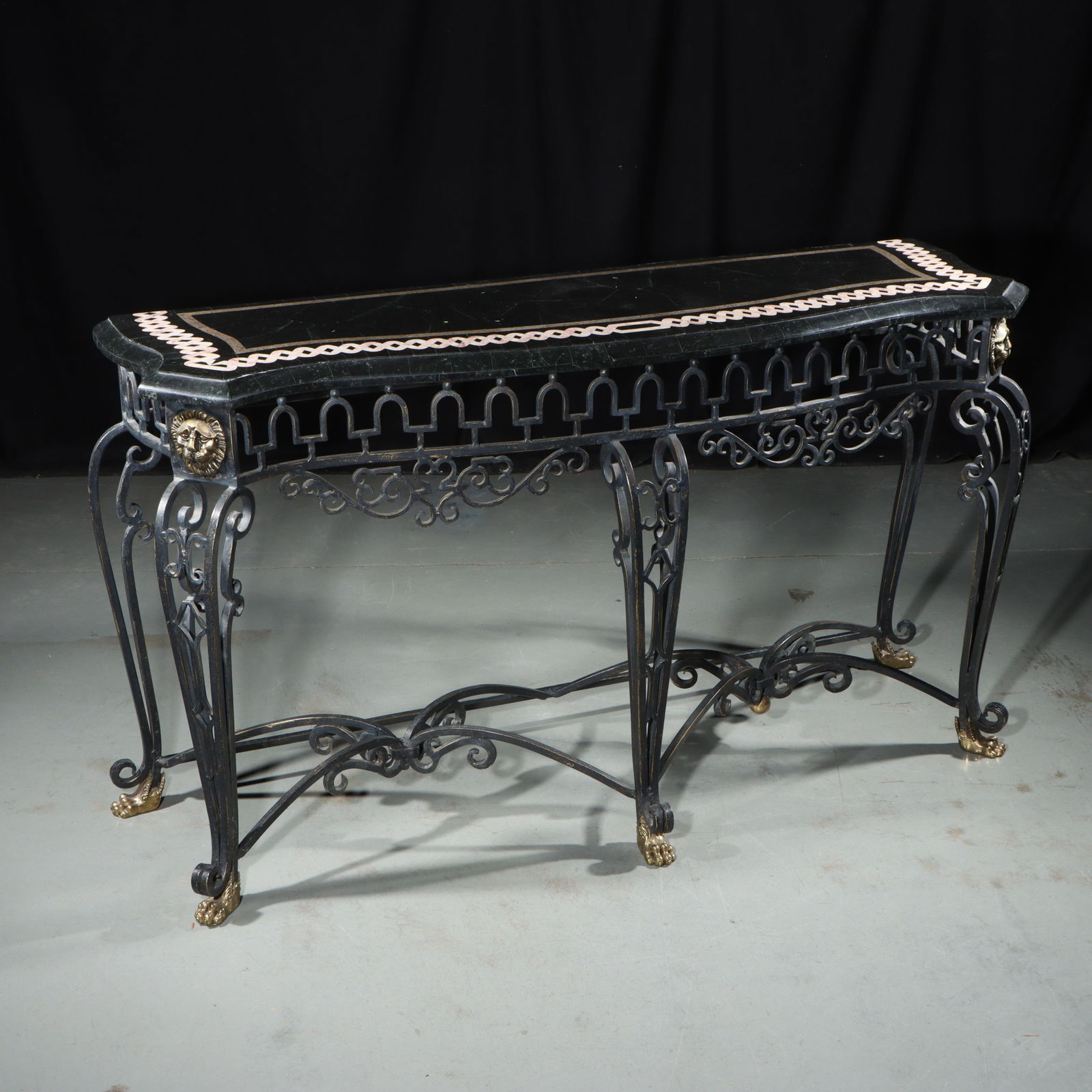 Louis XV style wrought iron console table with pattern inlaid marble / stone top with gilt paw feet: Louis XV style wrought iron console table with pattern inlaid marble / stone top with gilt paw feet and lion head medallion detail. 31 1/4"H x 55 1/2"W x 17 1/4"D