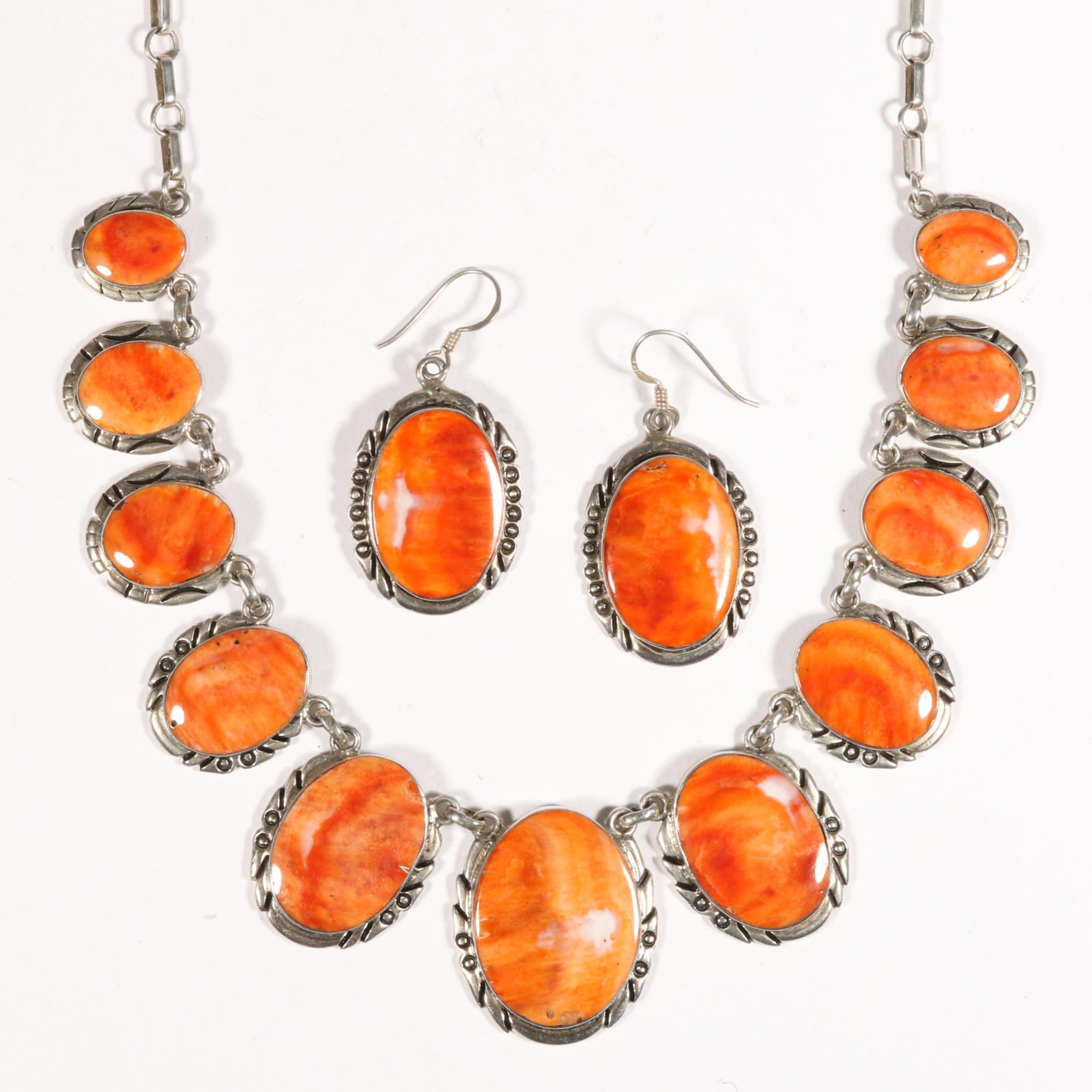Native American sterling silver and bright orange spiny oyster necklace and matching earrings,: Native American sterling silver and bright orange spiny oyster necklace and matching earrings, signed "J E Sterling" 21"L x 1 1/4"W (necklace)