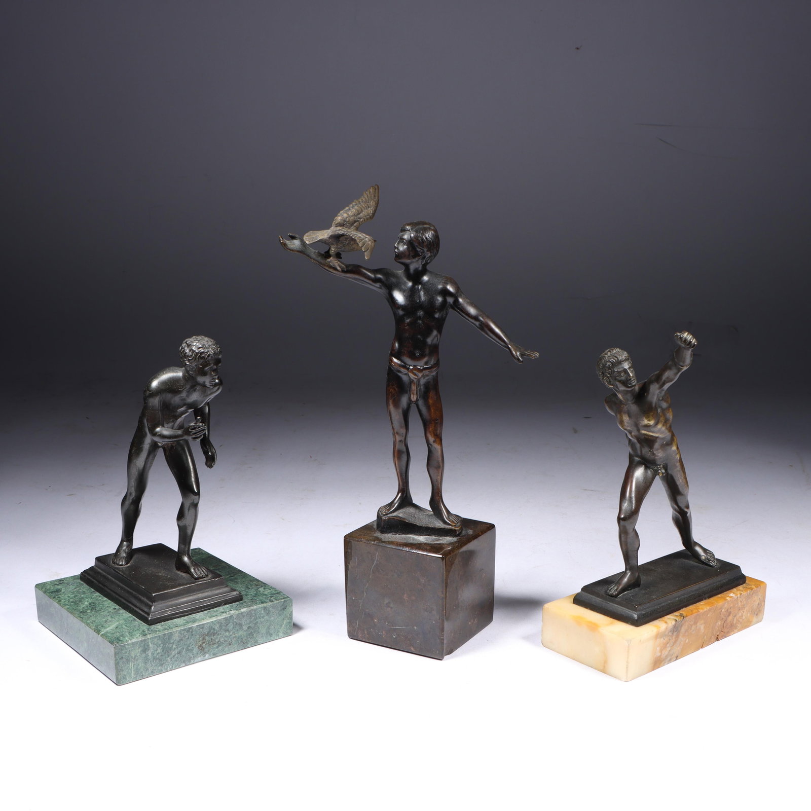 Three bronze Grand Tour cabinet statues of Neoclassical men on marble bases; Alfred Moret, French, (1 of 13)