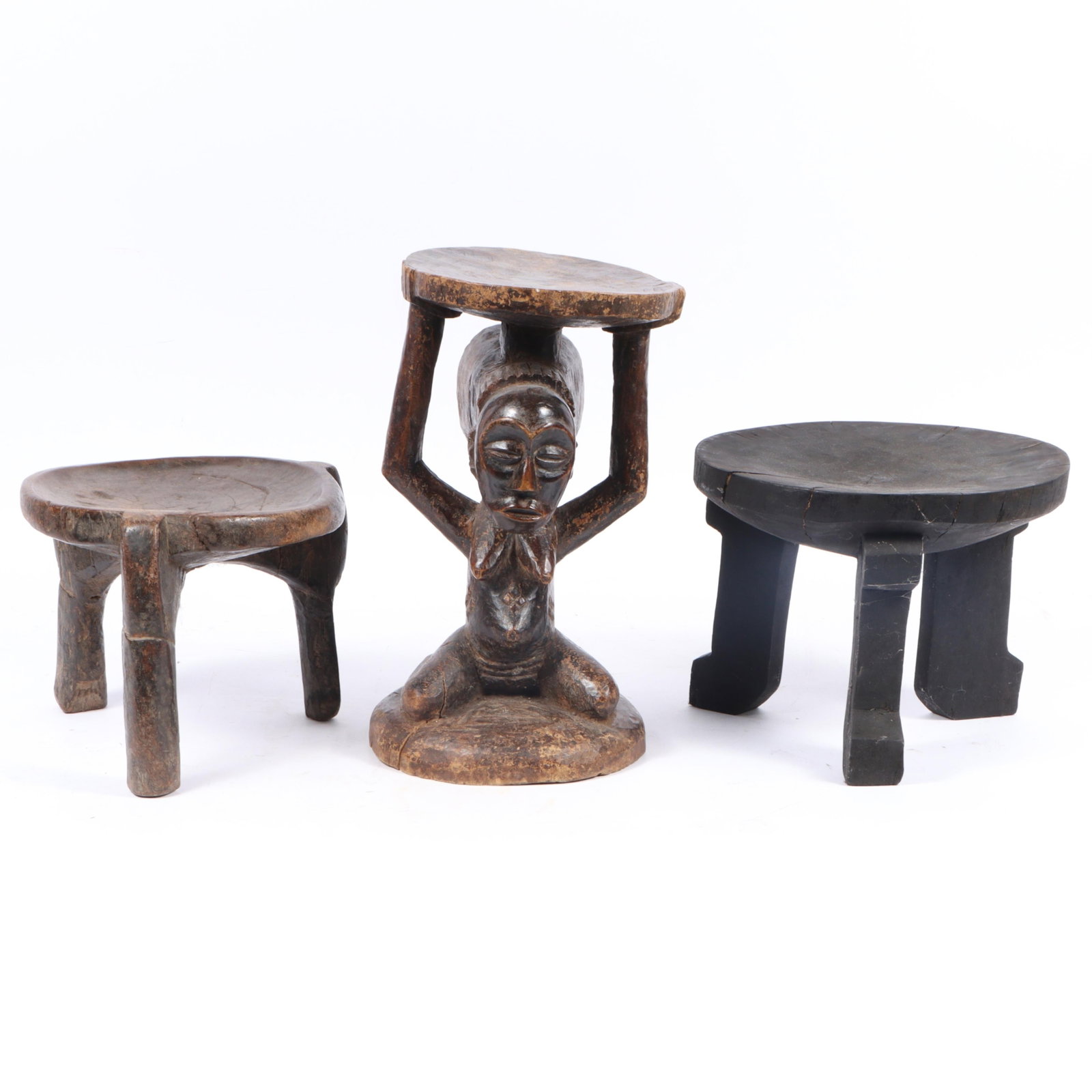 Three African carved wood stools: tripod stools, caryatid stool, Democratic Republic of Congo 15"H x (1 of 10)