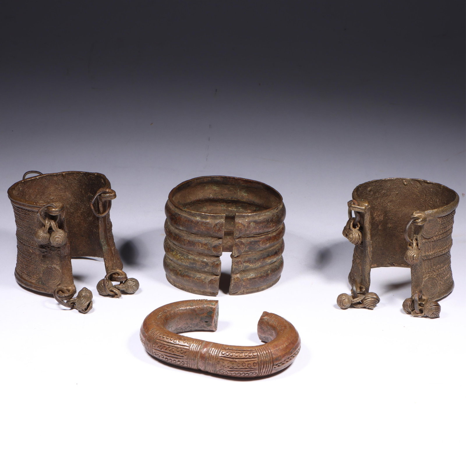 Four African bronze tribal currency bracelets 2 1/2"W x 2 1/2"Diam. (one bracelet measured) (1 of 7)