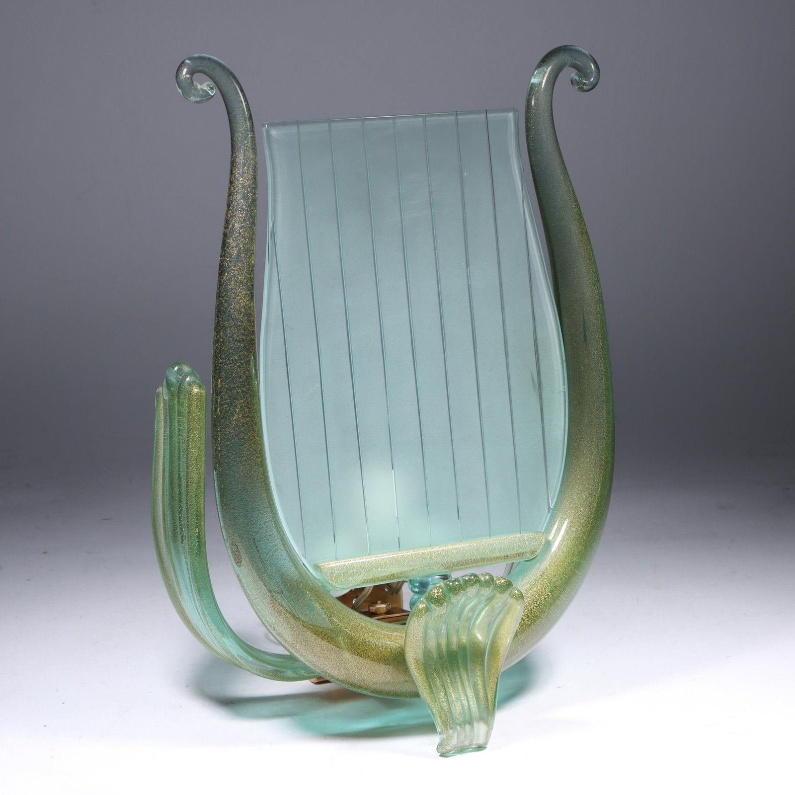 Seguso Vetri d'Arte, attributed, Murano art glass Lyre form wall sconce 15"H x 11"W: Seguso Vetri d'Arte, attributed, Murano art glass Lyre form wall sconce Elegant Murano glass green and gold leaf modeled framing with wings and shell appliques. original etched glass plate shade on or