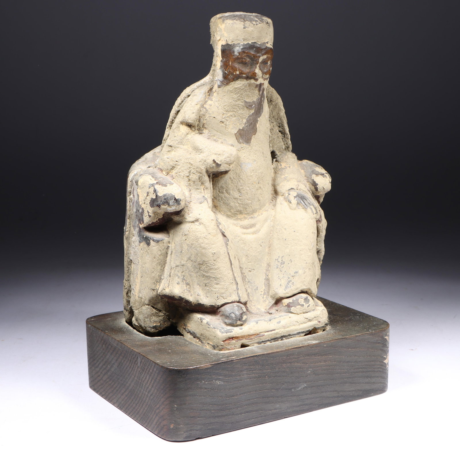 Chinese Ming Dynasty polychrome earthenware seated figure, sculpture. 9"H x 6"W: Chinese Ming Dynasty polychrome earthenware seated figure, sculpture. A weathered sculpture depicting a seated figure, This item is a Ming Dynasty terracotta pottery figure of a seated official or lor