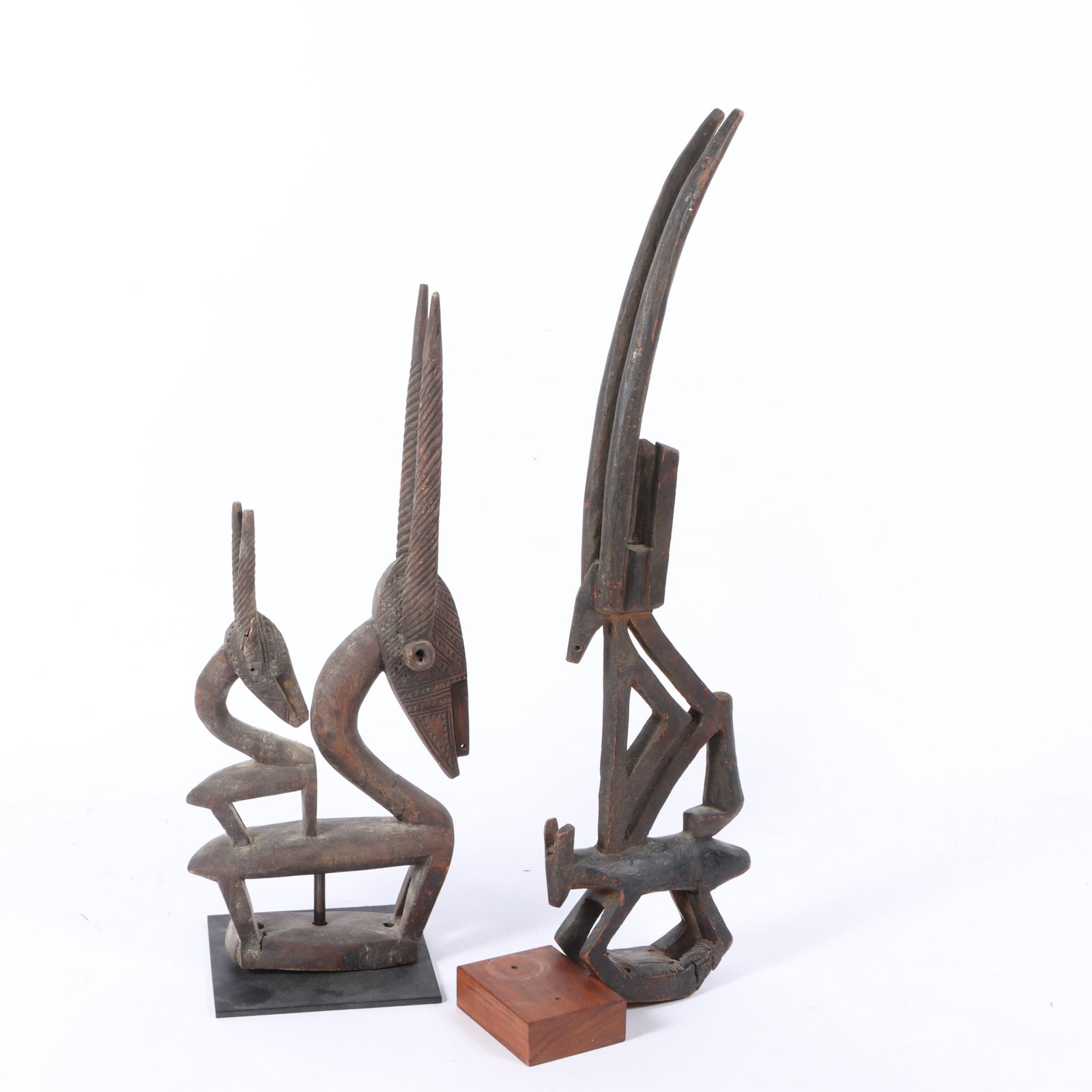 Two African Bamana culture, Mali, Chi Wara antelope form carved wood dance crests, 25"H x 2 1/2"W x (1 of 7)