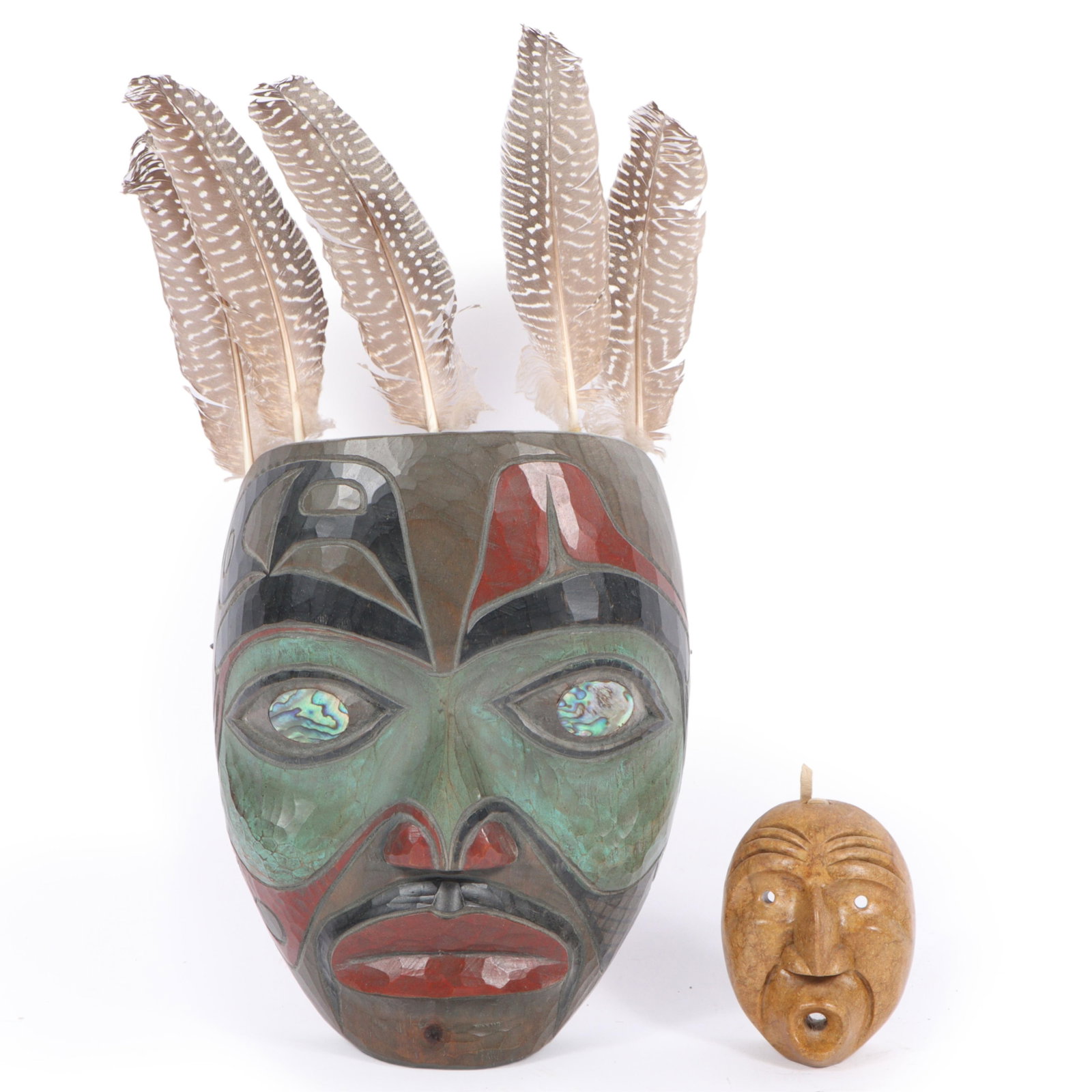 Two signed tribal masks: Odin Lonning (Tlingit, b. 1953) "Shaman portrait" polychrome carved cedar (1 of 8)