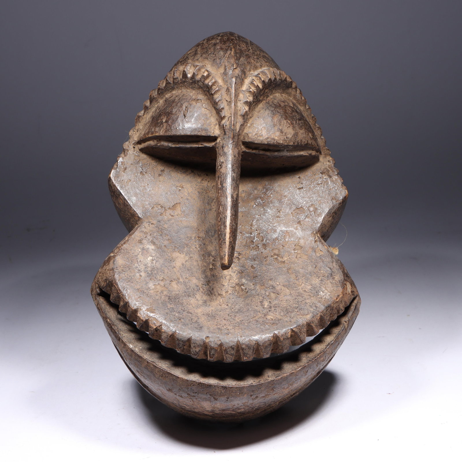 African Hemba carved wood tribal Soko Mutu Chimpanzee Mask, Congo DRC. 11"H x 7 1/2"W: African Hemba carved wood tribal Soko Mutu Chimpanzee Mask, Congo DRC. This is a traditional African mask, likely from the Hemba people. It features a stylized representation of a chimpanzee, known as