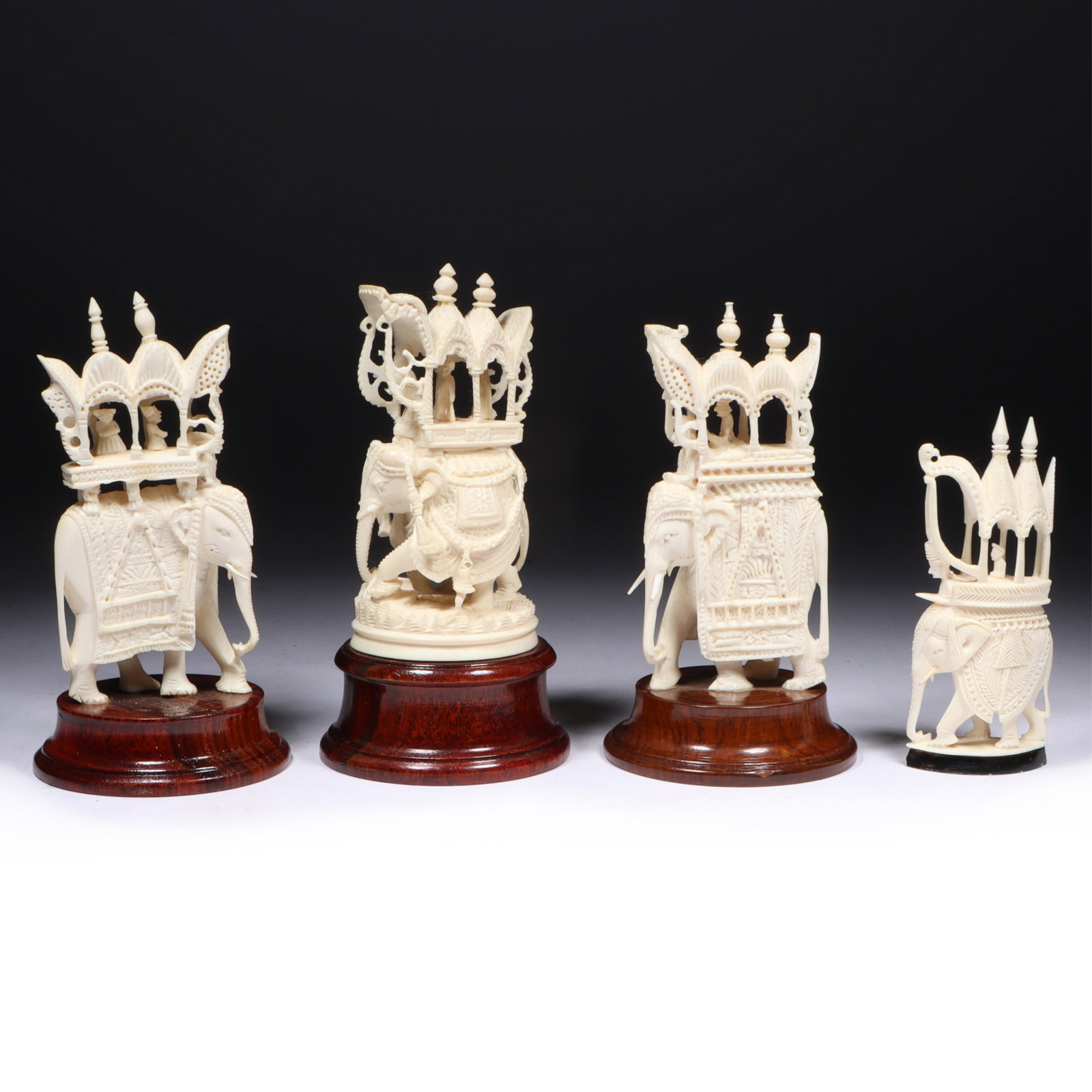 Four Antique Indian carved bone statuette sculptures depicting elephants carrying howdahs mounted on (1 of 19)