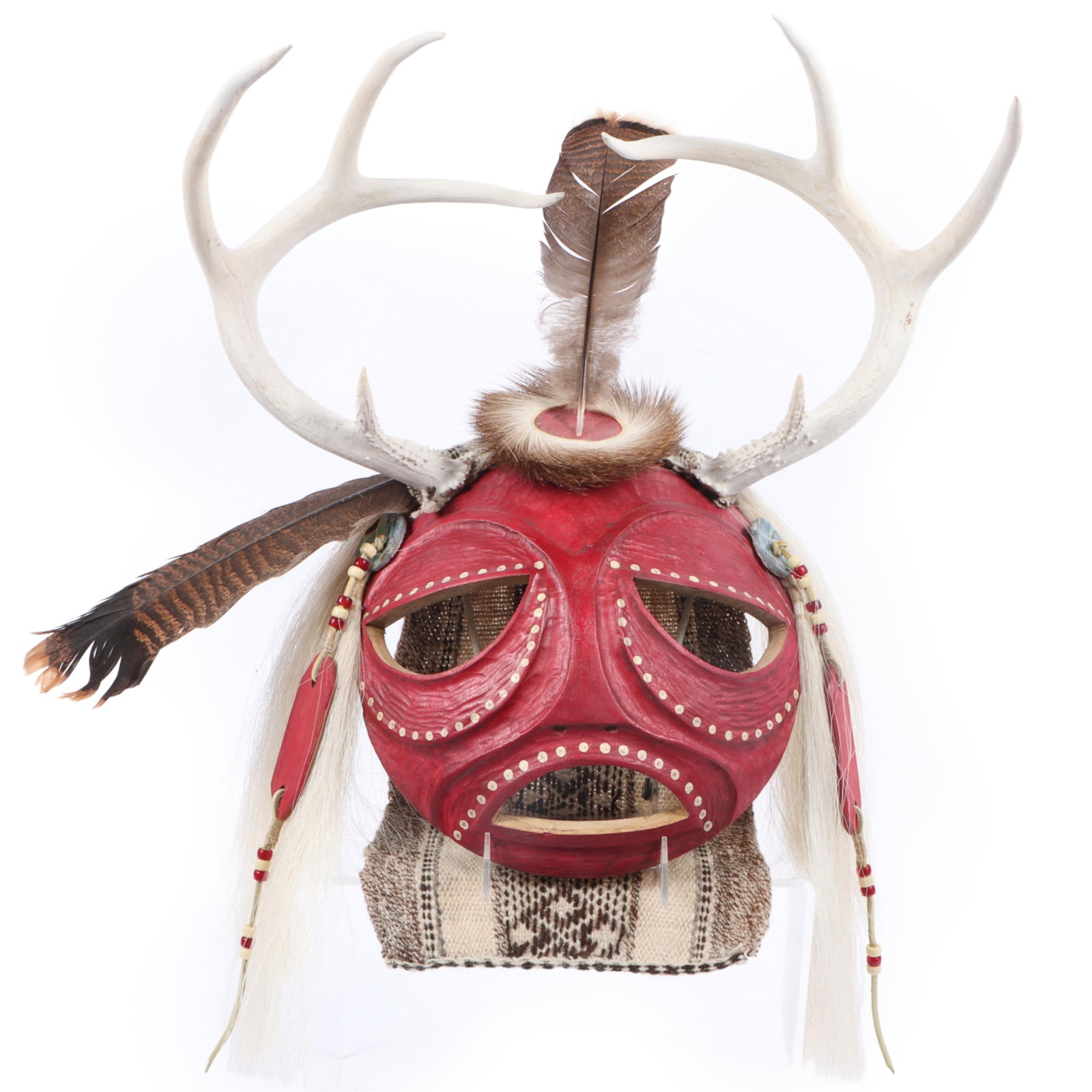 Gerard Tsonakwa (b. 1943) Abenaki Native American Indigenous ?Odzihozo? carved and painted spirit: Gerard Tsonakwa (b. 1943) Abenaki Native American Indigenous ?Odzihozo? carved and painted spirit mask with applied antlers, fur, feathers, beads, and woven textile, 2002 Signed and dated verso. Alpha