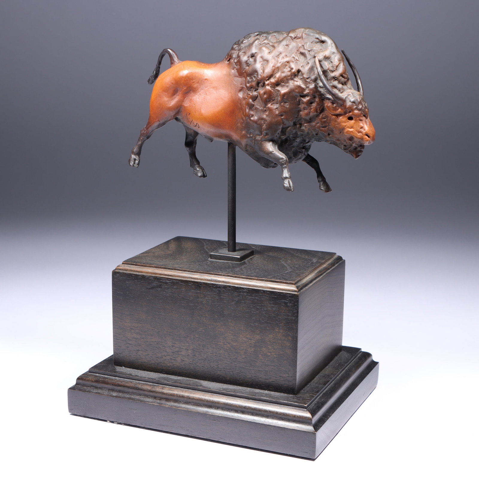 Star Liana York, American (b. 1952), bison, bronze, 9"H x 4 3/4"W: Star Liana York American (b. 1952) bison bronze mounted on a wooden plinth. Signed with initials on leg, numbered 24/50. Provenance: purchased from Meyer Gallery 2/1998. Biography from the Archives of