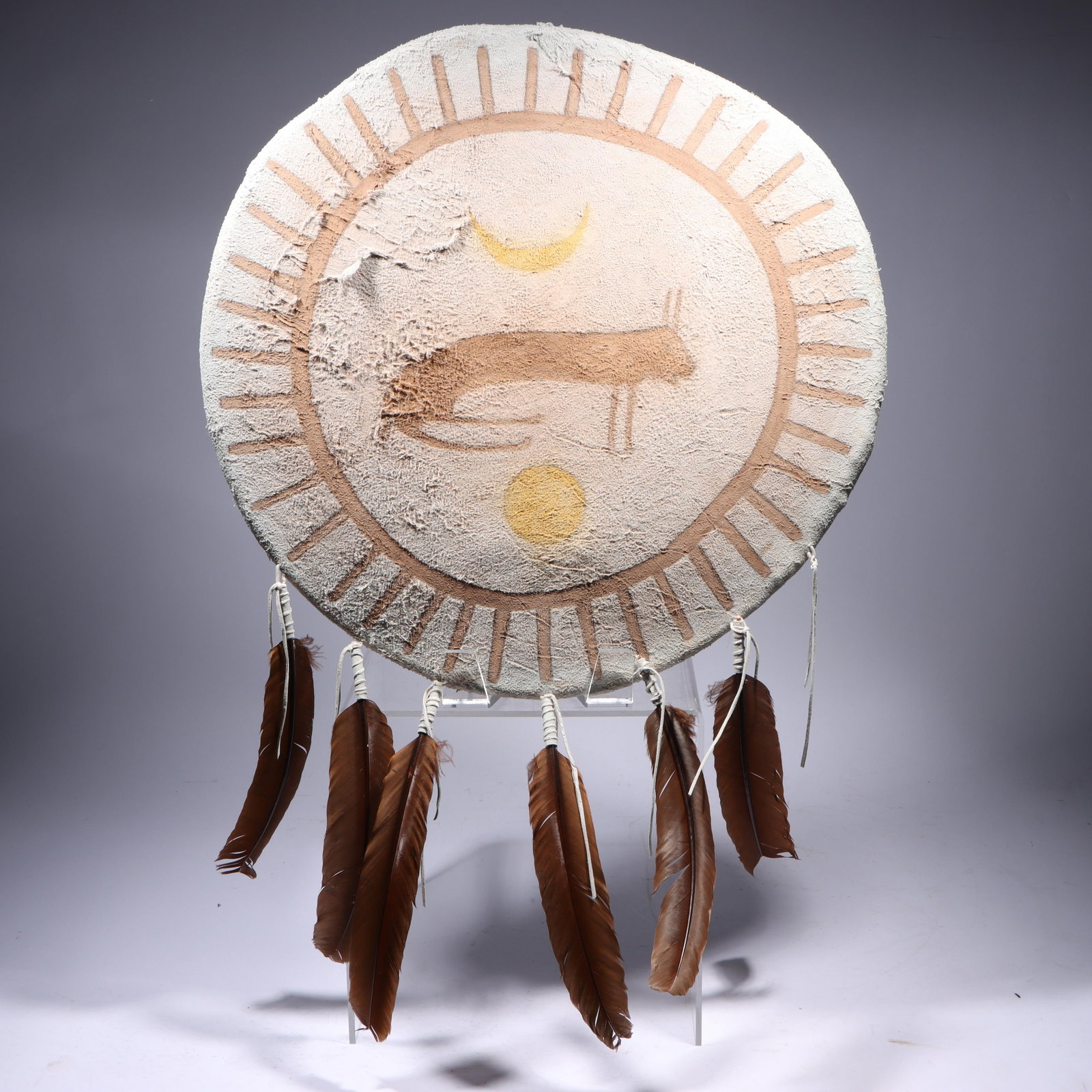 Native American style painted hide shield with animal / celestial motif and feathers, 1988 30"H x (1 of 9)