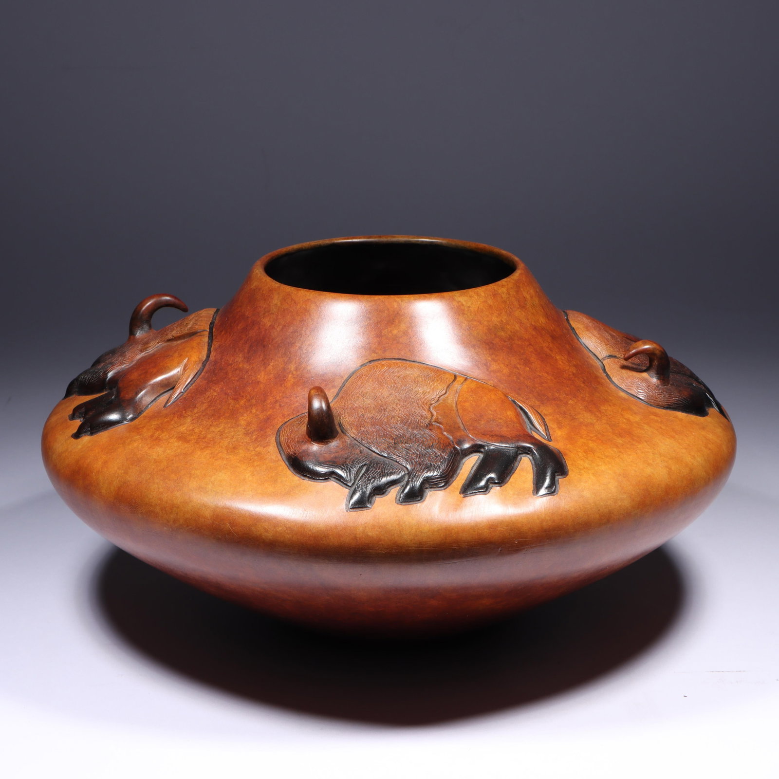 Pahponee (Kickapoo) "In a Sacred Manner I Walk" bronze vessel with dimensional buffalo, 2000 7"H x: Pahponee (Kickapoo) "In a Sacred Manner I Walk" bronze vessel with dimensional buffalo, 2000 Incised signature and date, numbered 21/25. Provenance: purchased at Eiteljorg Indian Market-Award Winner i