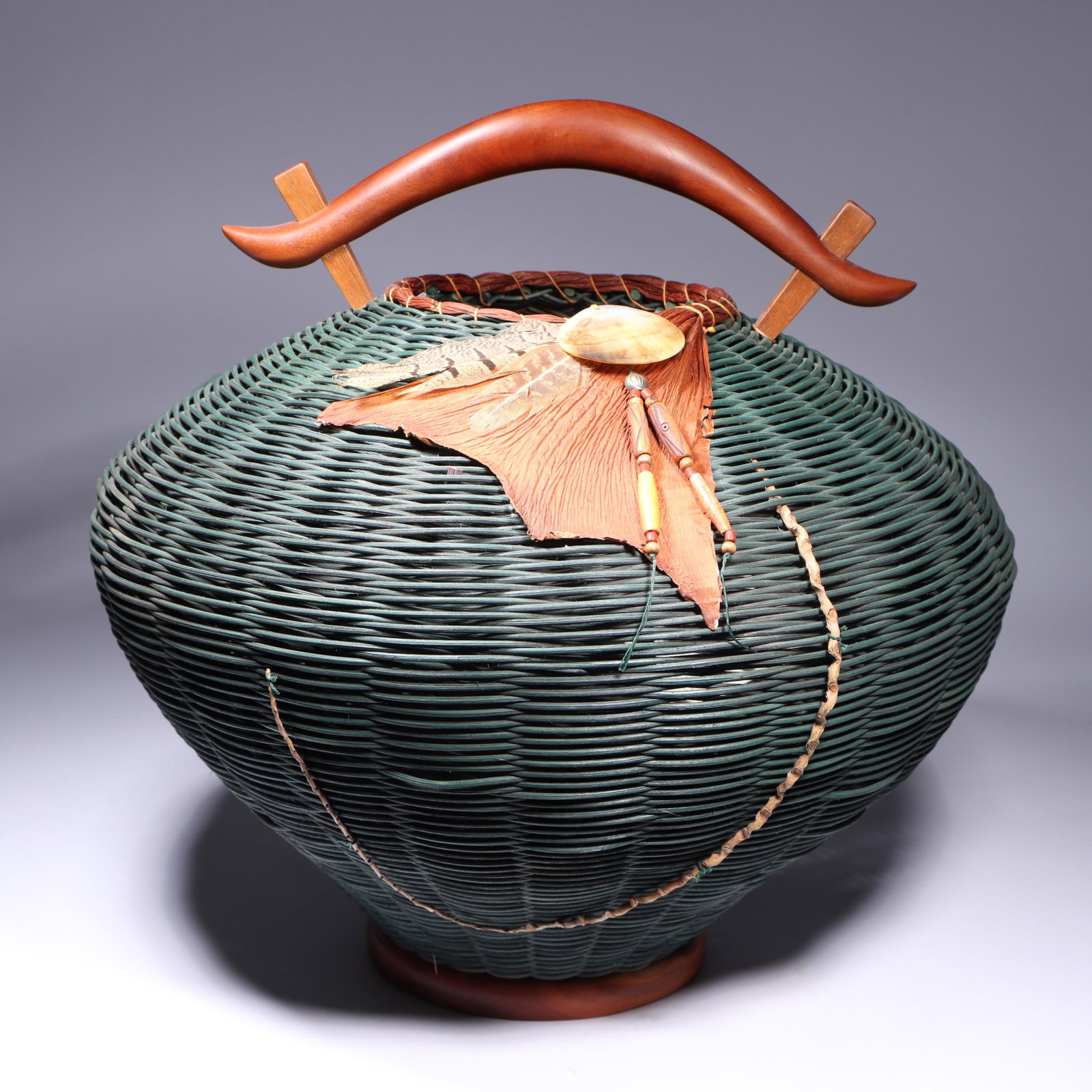 Peggy and Joe Henderson Pagoda basket, Hickory Hill Baskets, Brown County, IN, 2001 16"H x 14: Peggy and Joe Henderson Pagoda basket, Hickory Hill Baskets, Brown County, IN, 2001 Cherry walnut, hand-dyed reed, philodendron, shell, beads, feathers, palm. 16"H x 14 1/2"Diam.