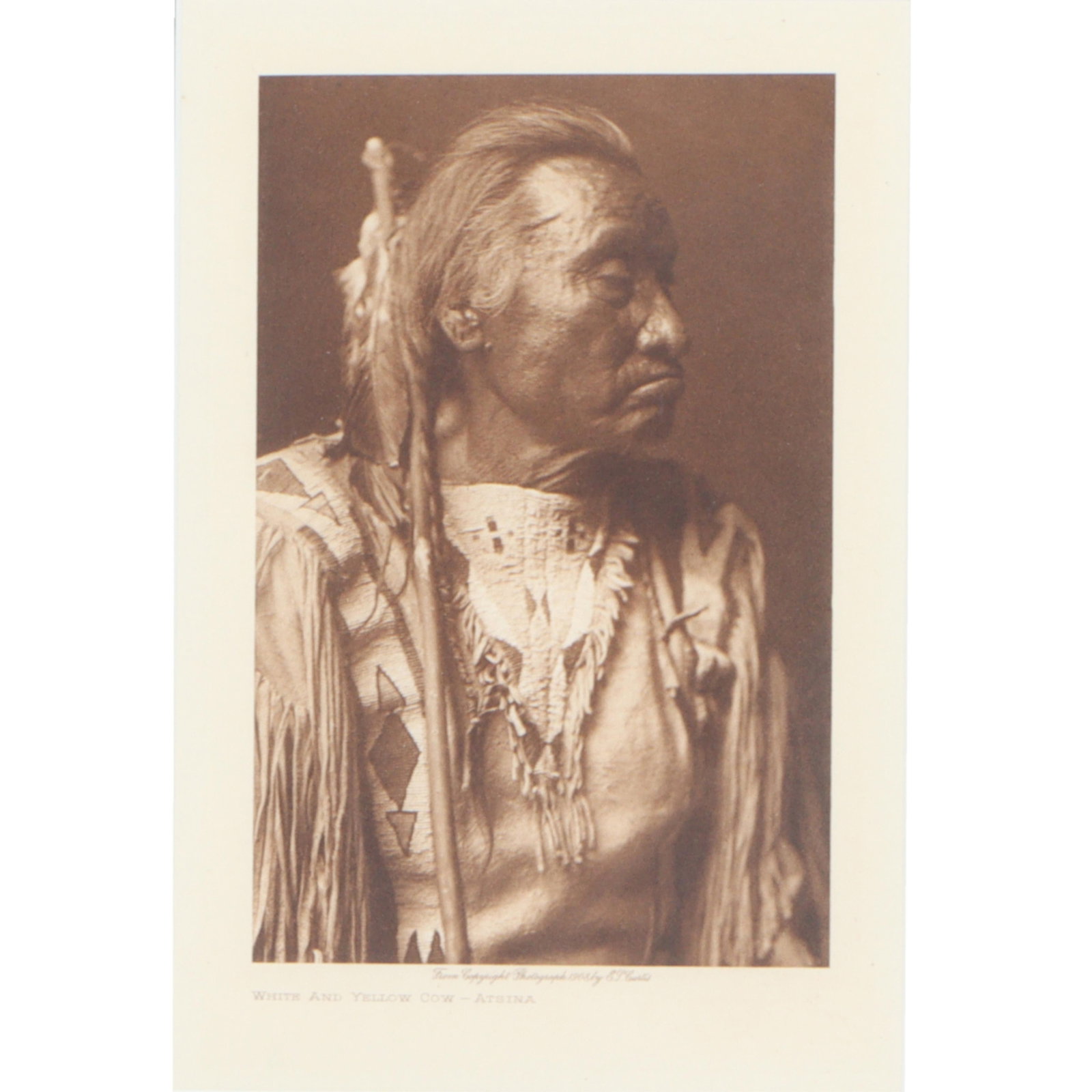 Edward S Curtis, American (1868–1952), White and Yellow Cow-Atsina, Photogravure, 9"H x: 18"H x 14 3/4"W(frame)Edward S CurtisAmerican, (1868–1952)White and Yellow Cow-AtsinaPhotogravureFramed Photogravure is a portrait of a Native American man titled "White and Yellow Cow - Atsina," ta