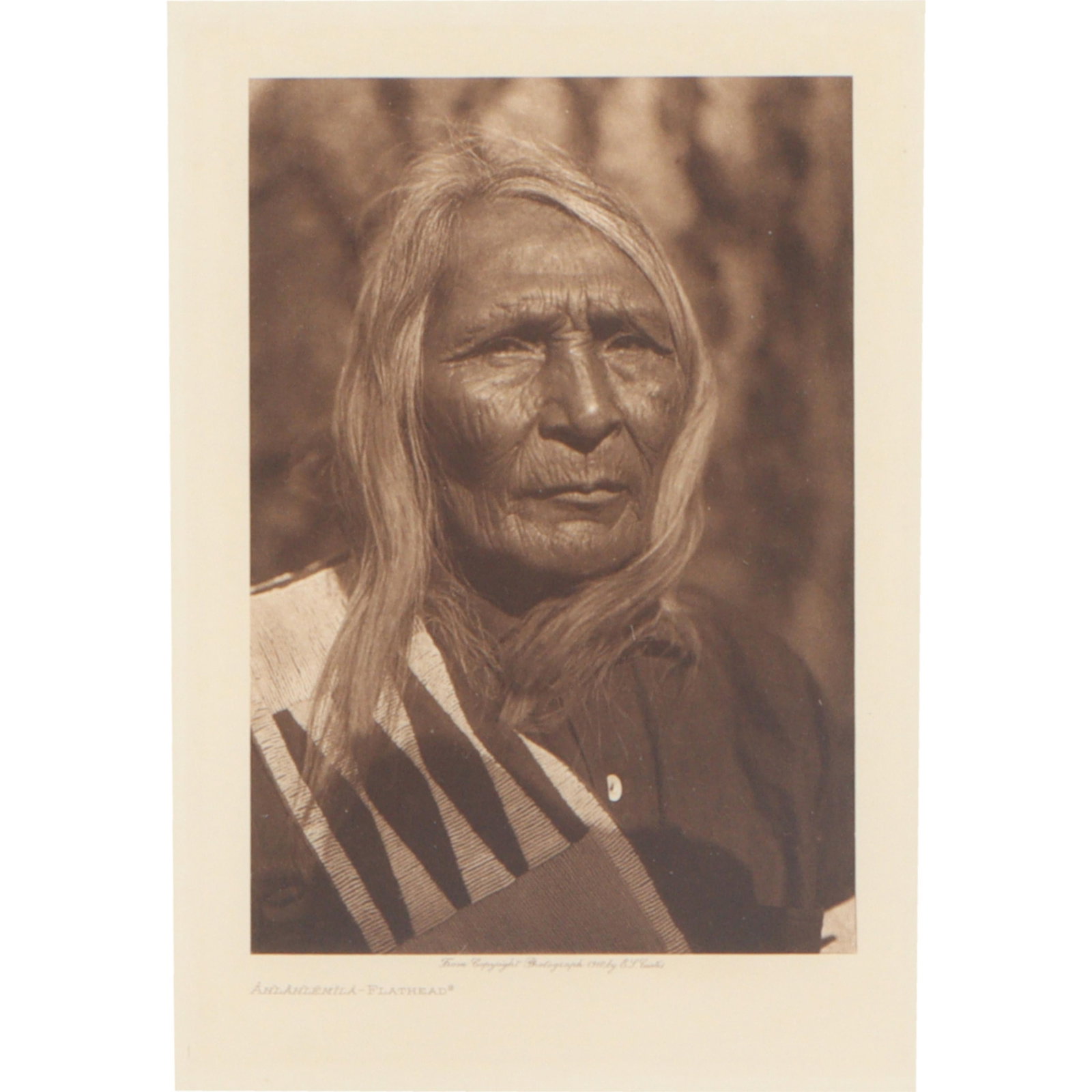 Edward S Curtis, American (1868–1952), Ahlahlemila - Flathead, Photogravure, 9"H x 6 1/4"W(sight),: Description:Edward S CurtisAmerican, (1868–1952)Ahlahlemila - FlatheadPhotogravureFramed photo of an orginal photogravure titled "Ahlahlemila - Flathead by Edward S. Curtis. It depicts a portrait of