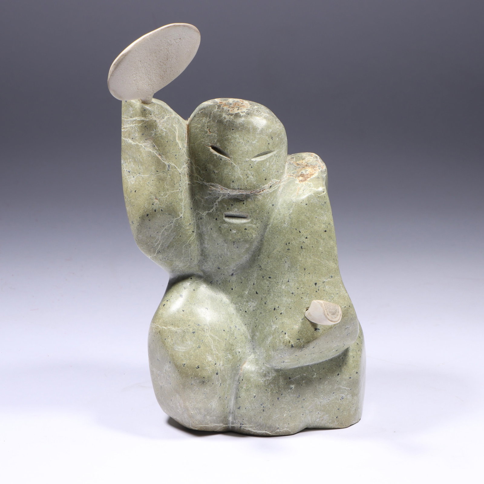 Leenoo Kublu, Pond Inlet, N.W.T. / Canadian 20th Century, Drum Dancer #8213-39, 1982, carved: Leenoo Kublu Pond Inlet, N.W.T. / Canadian 20th Century Drum Dancer #8213-39, 1982 carved soapstone / serpentine with bone accessories Canadian Eskimo art label and card present. 9 1/2"H x 5"W