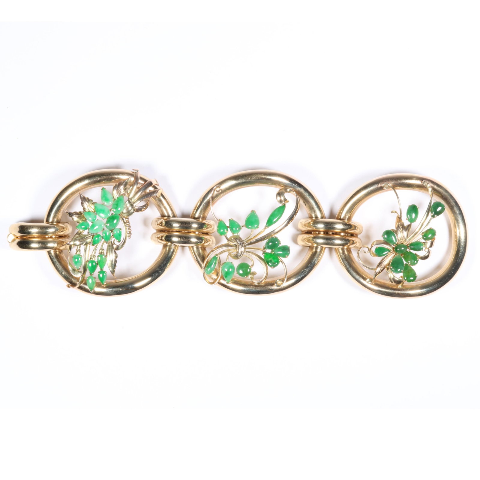 14K Yellow Gold Three Panel Chinese Jadeite Jade Floral Statement Bracelet 7 1/2"L x 2"W: 14K Yellow Gold Three Panel Chinese Jadeite Jade Floral Statement Bracelet 62.70 dwt. Signed "Tiffany" The purchase of gold requires confirmed funds. 7 1/2"L x 2"W