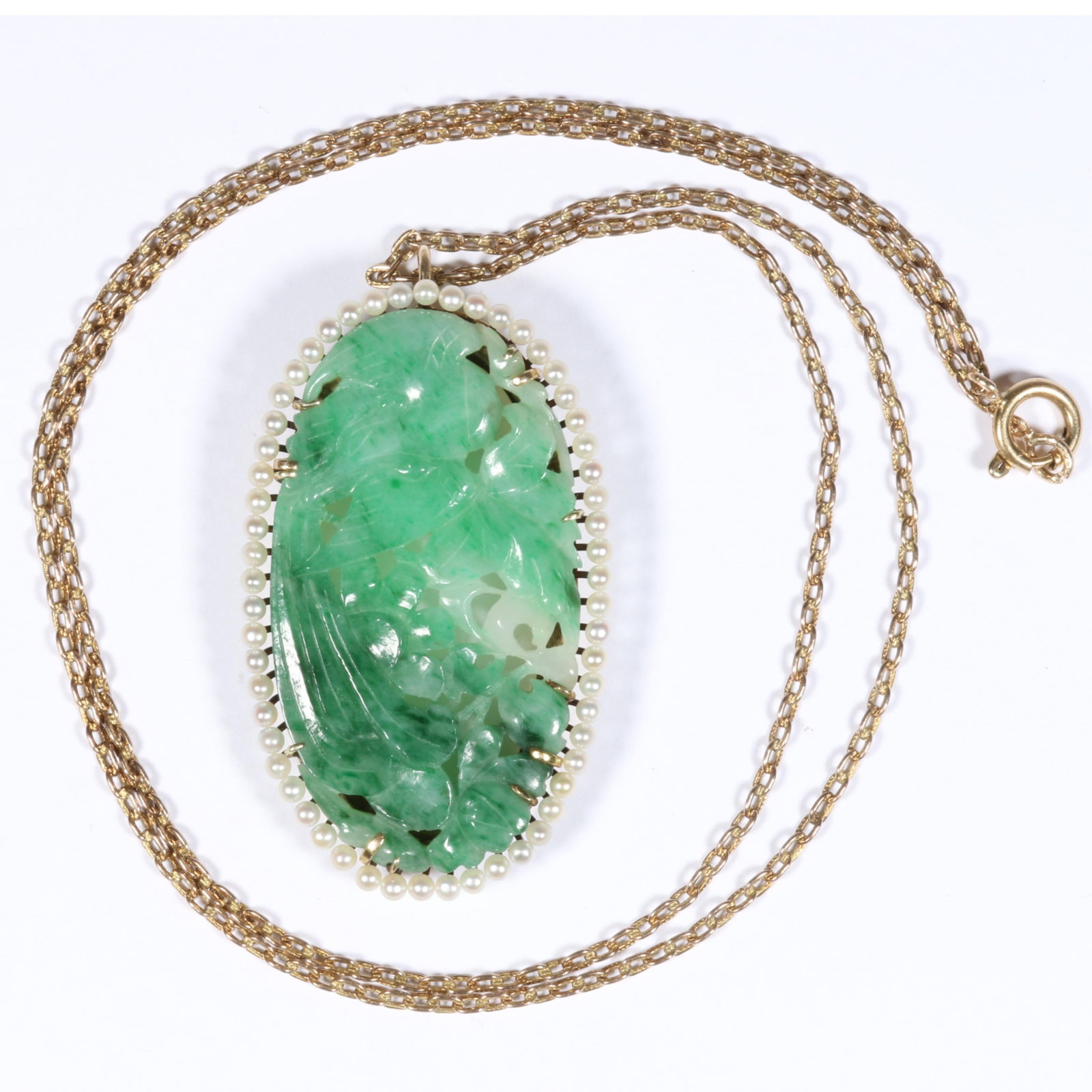 14K Yellow Gold Variegated Apple Green Chinese Jadeite Jade Carved Floral and Bird Pendant: 14K Yellow Gold Variegated Apple Green Chinese Jadeite Jade Carved Floral and Bird Pendant Surrounded by Seed Pearls, with 10K Gold Chain 13.50 dwt (pendant) 2.90 dwt (chain) Fine semi-translucency in
