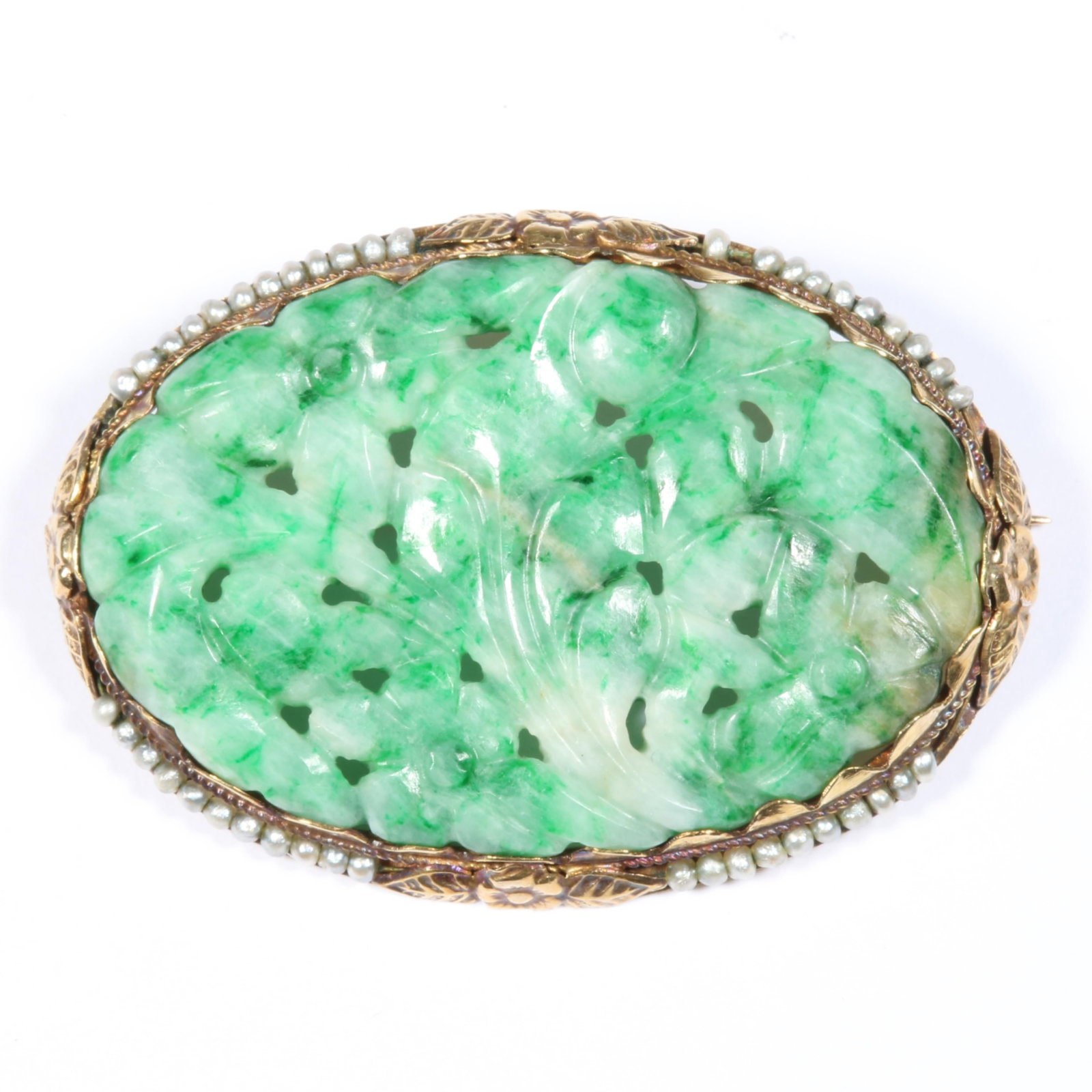14K Yellow Gold Floral Carved Chinese Jadeite Jade and Seed Pearl Brooch with Four Flower Stations: 14K Yellow Gold Floral Carved Chinese Jadeite Jade and Seed Pearl Brooch with Four Flower Stations Decorating the Bezel 8.25 dwt. Jadeite exhibits a dense translucency and is in very good condition wi