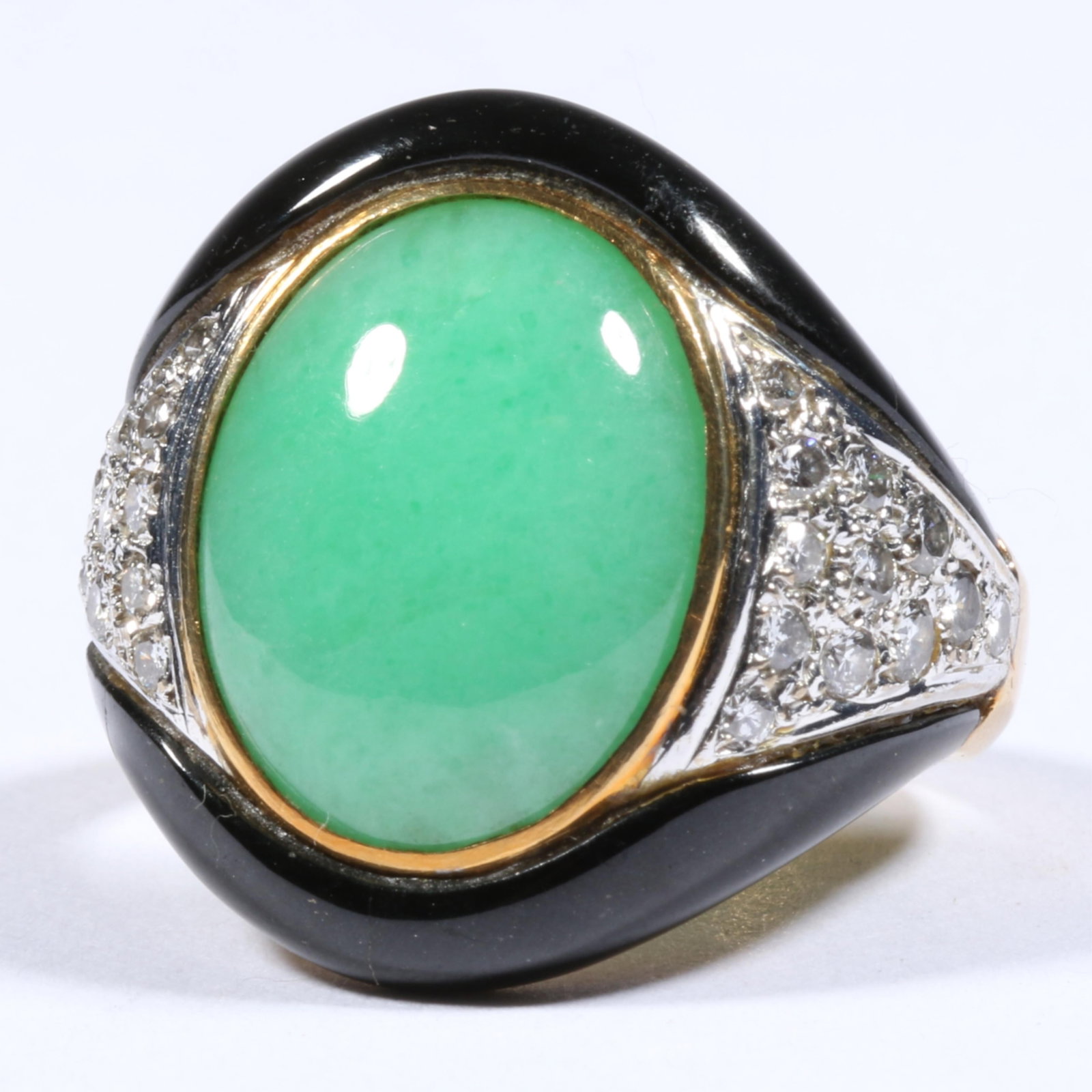 18K Two-Tone Art Deco Style Chinese Jadeite Jade Cabochon Ring Accented with Round Brilliant: 18K Two-Tone Art Deco Style Chinese Jadeite Jade Cabochon Ring Accented with Round Brilliant Pav?-Set Diamonds and Black Onyx Shoulders 7.0 dwt. Jadeite is in excellent condition, no chips, nicks, cra