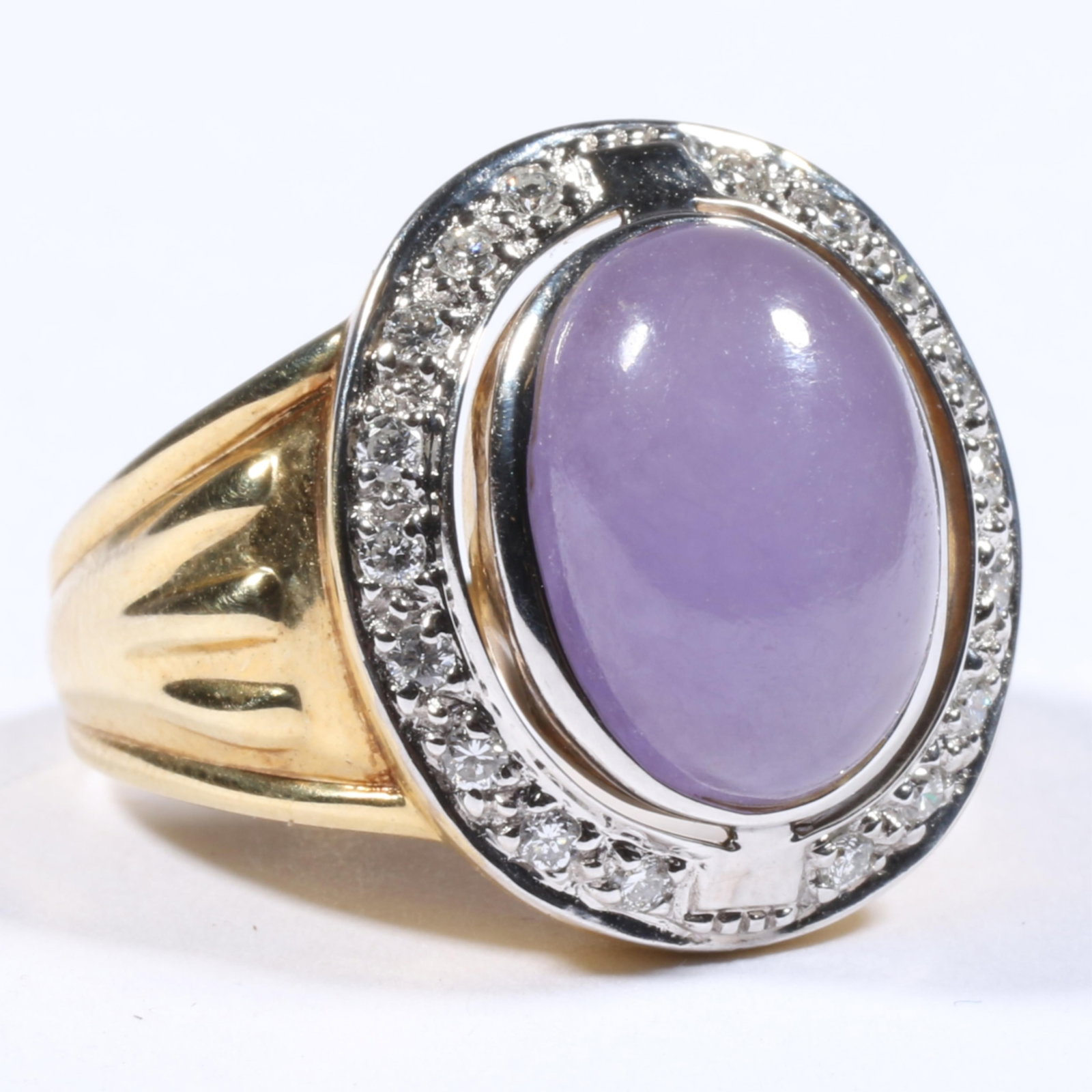 14K Yellow and White Gold Lavender Chinese Jadeite Jade Cabochon Ring with Diamond Halo Size 8: 14K Yellow and White Gold Lavender Chinese Jadeite Jade Cabochon Ring with Diamond Halo 7.10 dwt. Jadeite exhibits a semi-translucent quality and is in very good condition with no chips, nicks, or cra