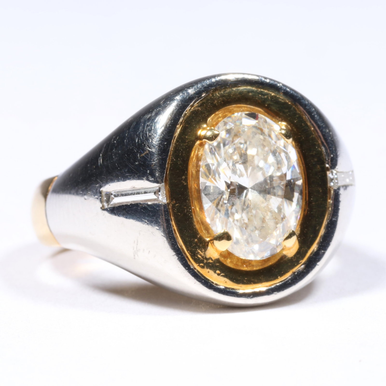 Harry Gaunt 18K Yellow Gold and Platinum Oval Diamond Ring, 2.63CT., Flanked with Two Baguette: Harry Gaunt 18K Yellow Gold and Platinum Oval Diamond Ring, 2.63CT., Flanked with Two Baguette Diamonds, Custom Made 9.19 dwt. 1 - oval diamond H, SI1, 2.63 cts. 2 - straight baguette cut diamonds, .0