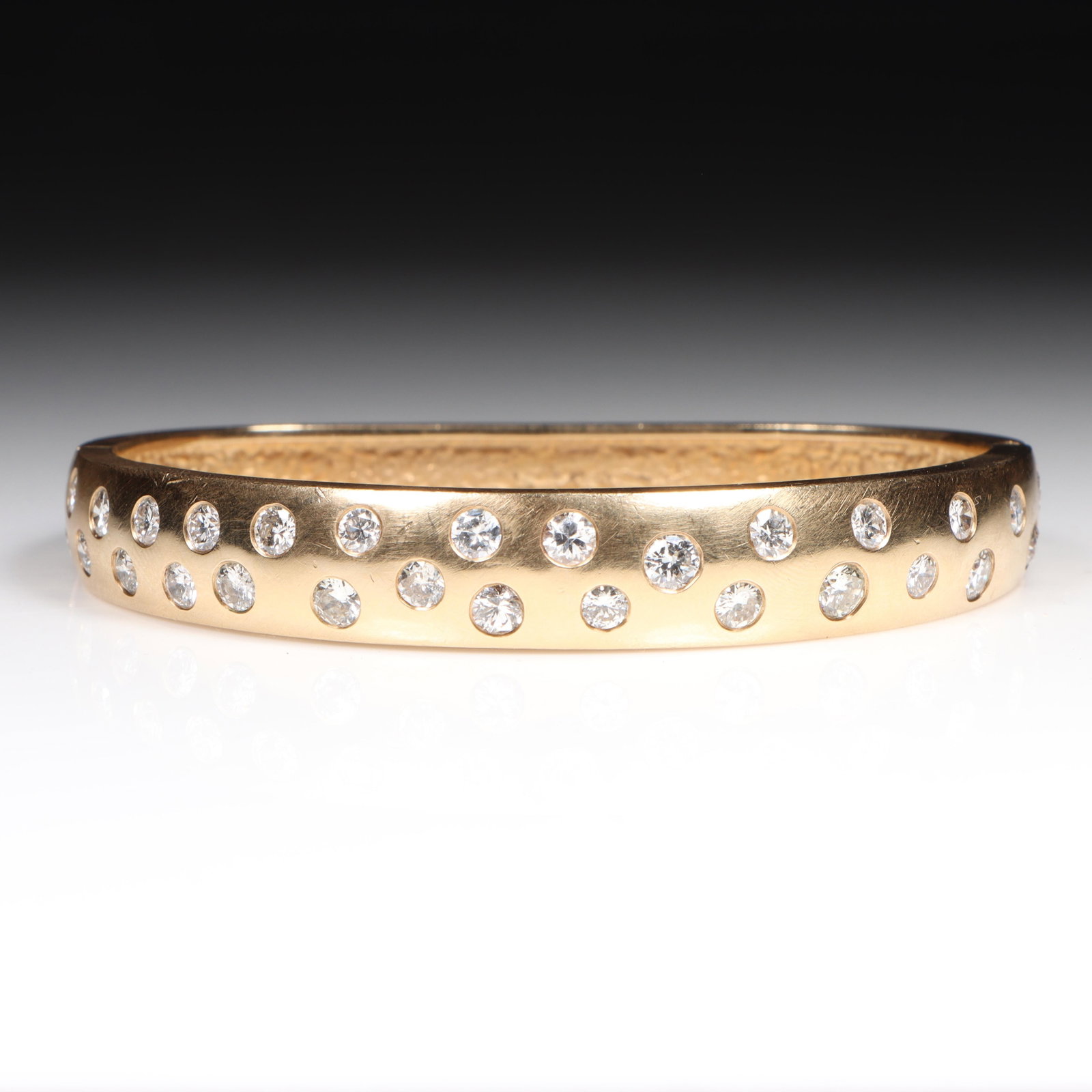 14K Yellow Gold Diamond Hinged Bangle Bracelet with approx. 3.96TCW Diamonds 3/8"W x 2 1/2"Inner: 14K Yellow Gold Diamond Hinged Bangle Bracelet with approx. 3.96TCW Diamonds 26.90 dwt. 30 - RBD's approx. 3.96cts., J-K color, SI2 clarity hand engraved on the side of the bracelet "logsdon 14k." The