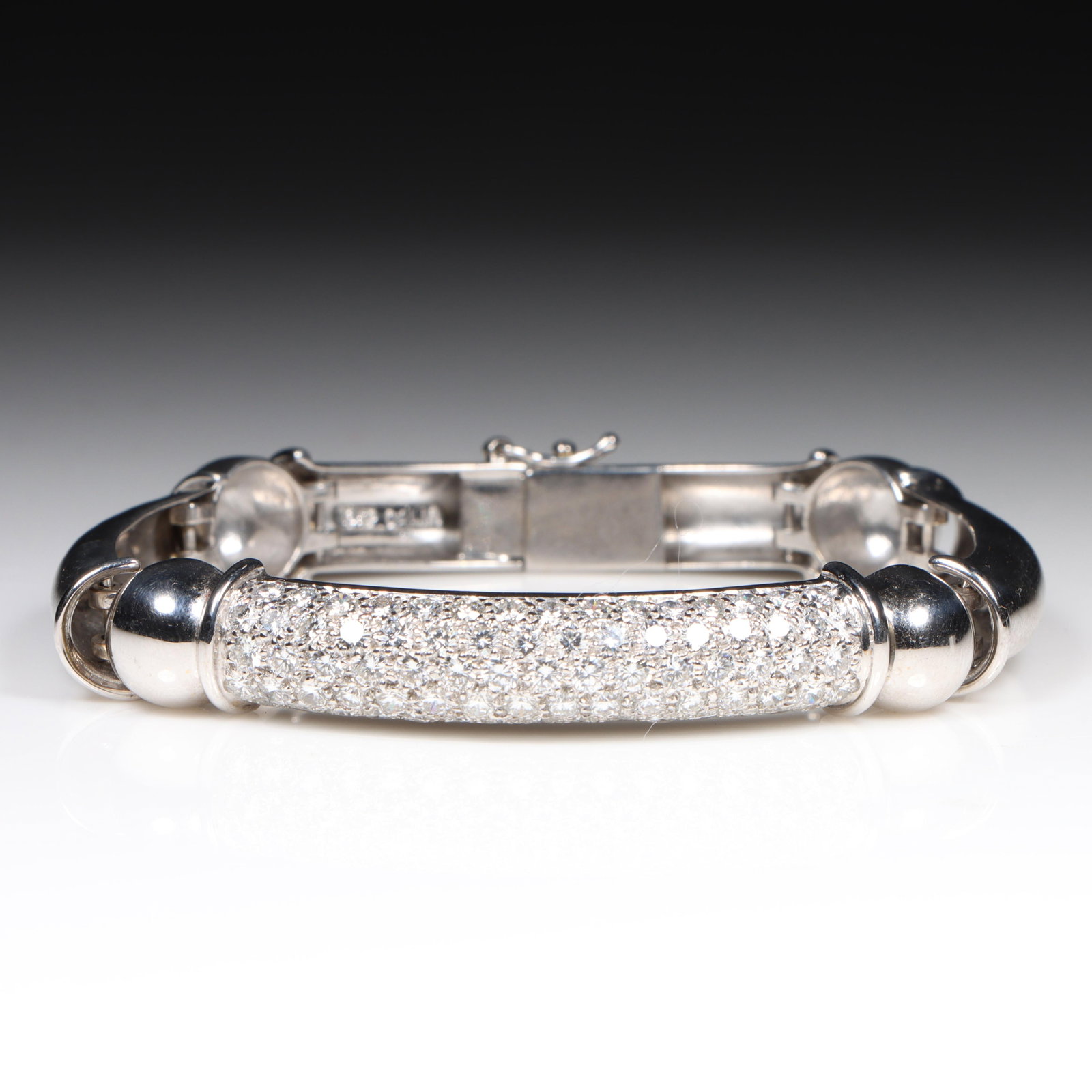 18K White Gold Segmented Bar Bracelet with Pave Set Diamonds, approx. 4.62tcw 3/8"W x 2 1/2"Inner: 18K White Gold Segmented Bar Bracelet with Pave Set Diamonds, approx. 4.62tcw 28.39 dwt. 77 - RBD's approx. 4.62tcw., G-H, VS2-SI1. Stamped "18KP" and "Dalia". The purchase of gold requires confirmed 