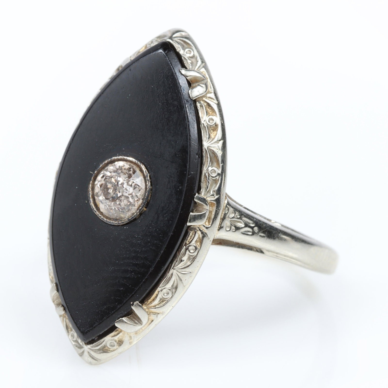 14K White Gold Art Deco Diamond and Black Onyx Ring Size 6 1/2 x 3/4"High: 14K White Gold Art Deco Diamond and Black Onyx Ring 2.0 dwt. 1 - old European cut diamond, approx. .20ct. The purchase of gold requires confirmed funds. Size 6 1/2 x 3/4"High