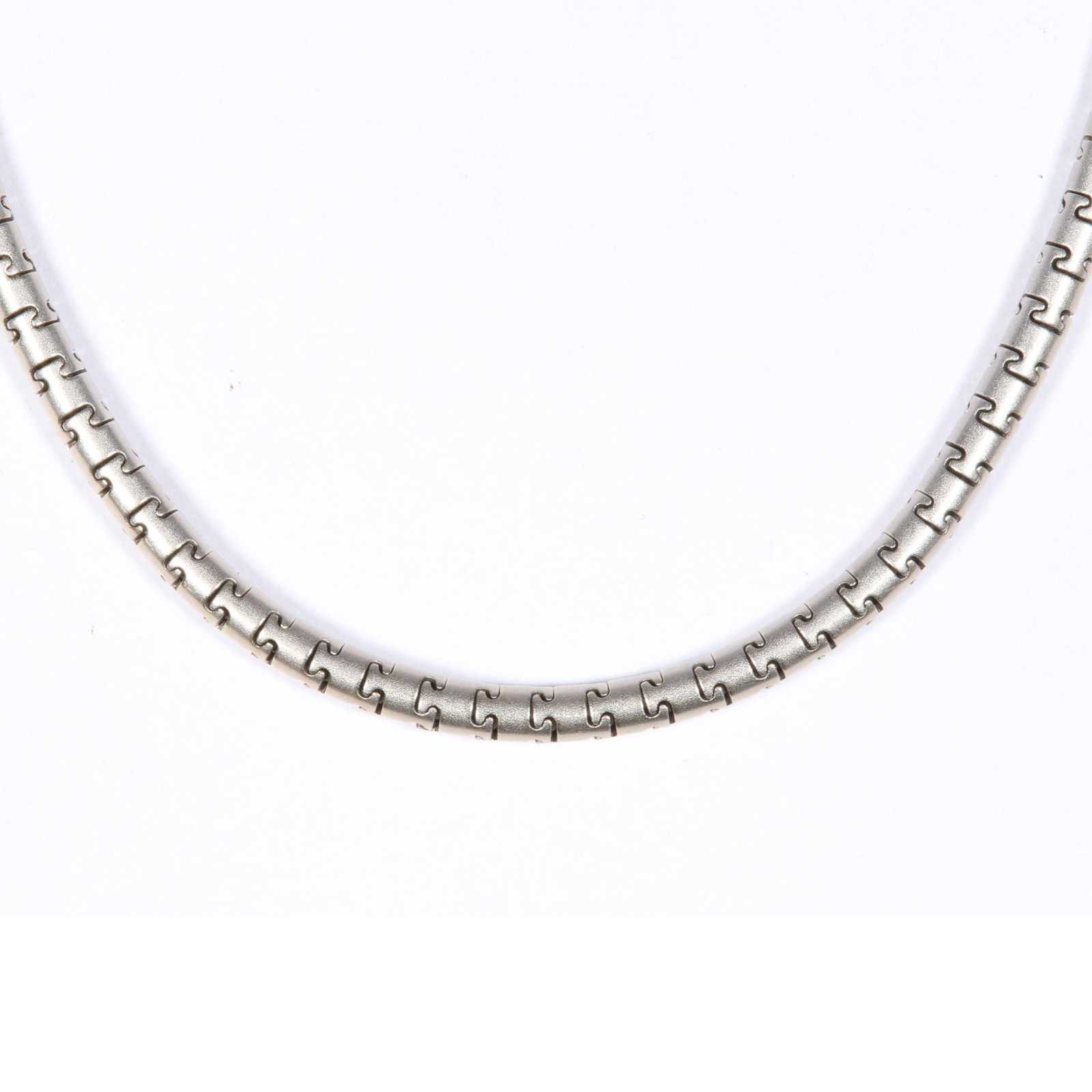 14K White Gold Matte Finish Puzzle Link Snake Chain 16"L x 1/18"W: 14K White Gold Matte Finish Puzzle Link Snake Chain 12.00 dwt. The clasp is stamped Germany. The purchase of gold requires confirmed funds. 16"L x 1/18"W
