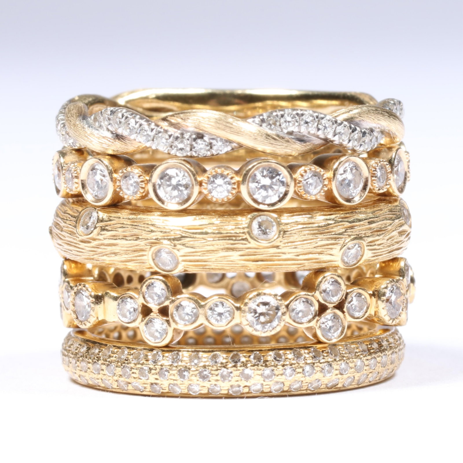 18K and 14K Yellow Gold 5pc Stack Ring Group with Diamonds, Bottom Three Are 18K All Approx. Size 7: 18K and 14K Yellow Gold 5pc Stack Ring Group with Diamonds, Bottom Three Are 18K 5.70 dwt 18K 3 rings total 3.40 dwt 14K 2 rings total 2nd from top 14K ring is unmarked and tested The purchase of gold
