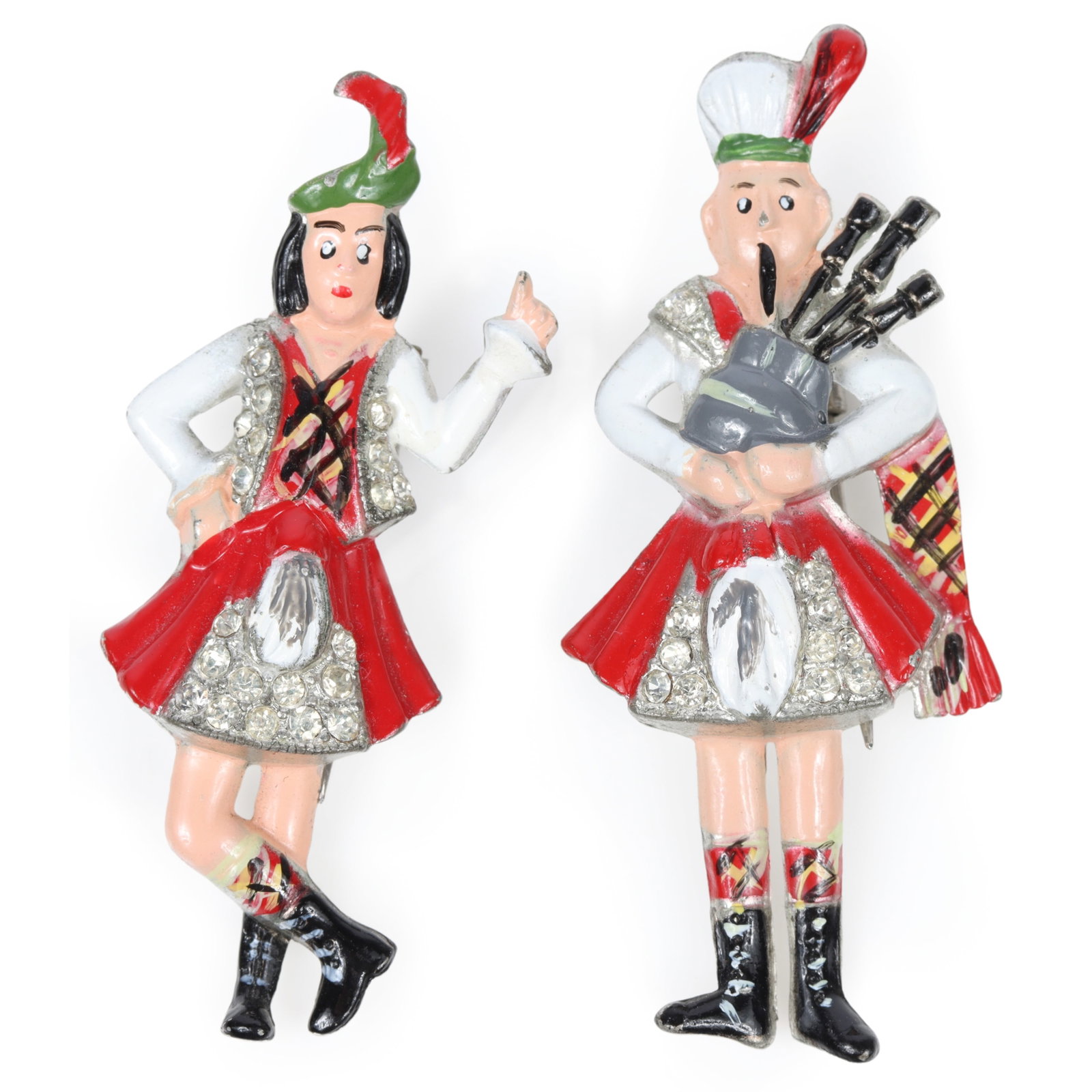 Coro Gene Verrecchio retro fur clip set featuring a Scottish bagpiper and a Highland dancing lady: Coro Gene Verrecchio retro fur clip set featuring a Scottish bagpiper and a Highland dancing lady with red enamel and rhinestones, unsigned 2 1/4"H x 1"W (male)