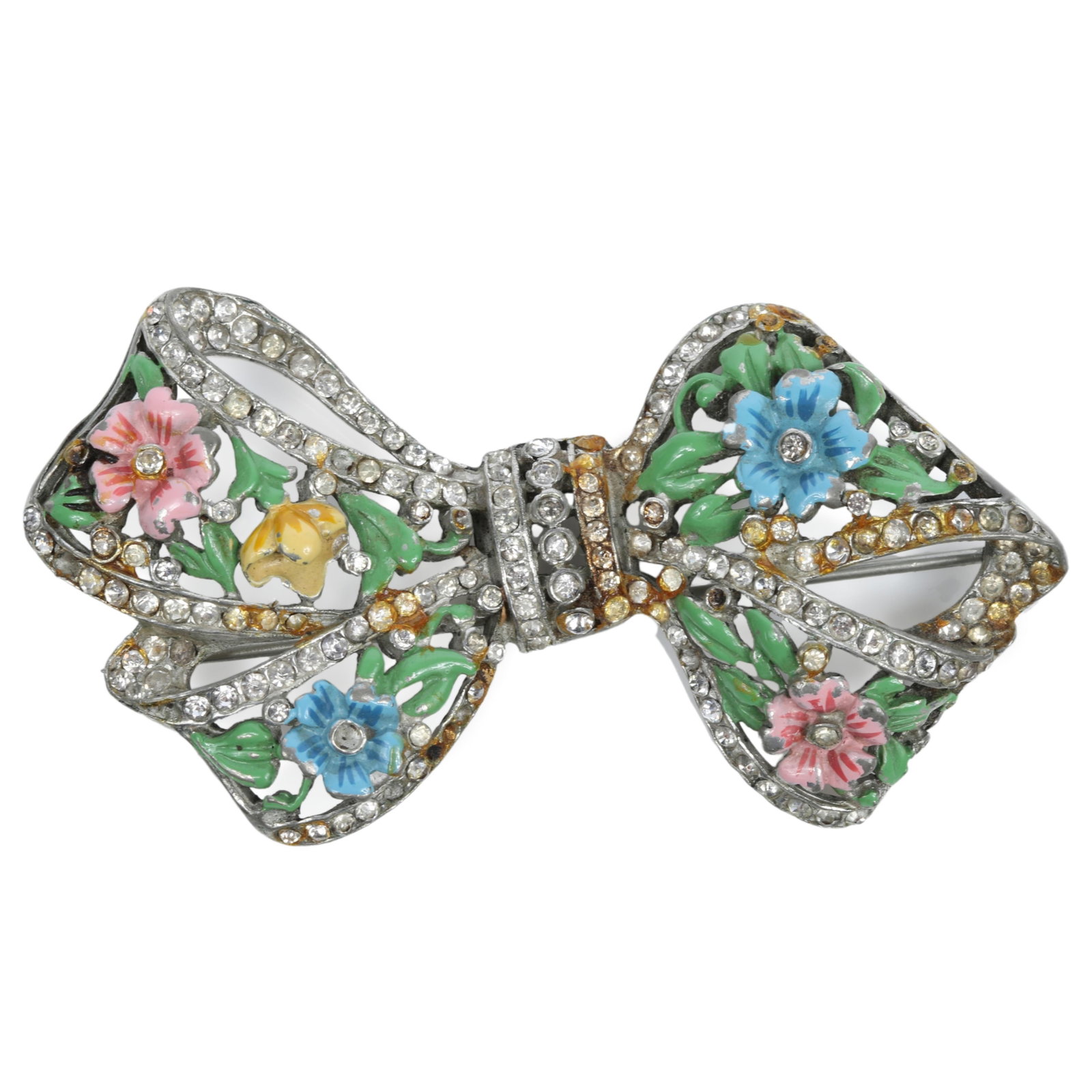 Chanel Novelty Co. book piece bow brooch with painted enamel flowers and pave-set rhinestones 1: Chanel Novelty Co. book piece bow brooch with painted enamel flowers and pave-set rhinestones "Fabulous Fakes" by Carole Tanenbaum, pg. 84 Some discoloration, missing several rhinestones 1 7/8"H 3 1/4