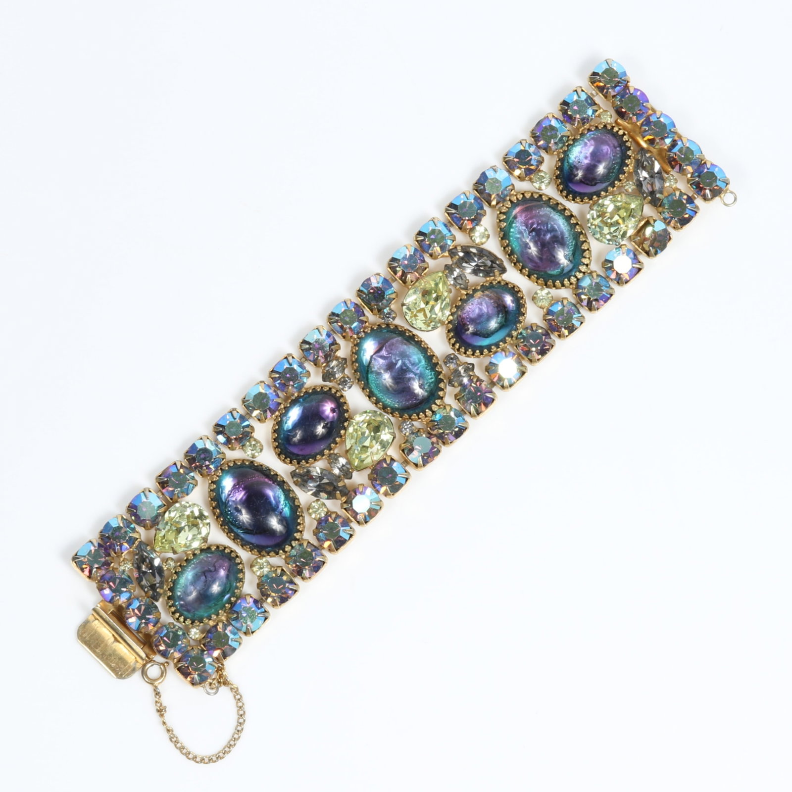 D & E Juliana book piece bracelet with fabulous teal and purple art glass cabochons, lemon yellow: D & E Juliana book piece bracelet with fabulous teal and purple art glass cabochons, lemon yellow jewels, and aurora borealis rhinestones "Fabulous Fakes" by Carole Tanenbaum, pg. 176 7"L x 1 3/4"W