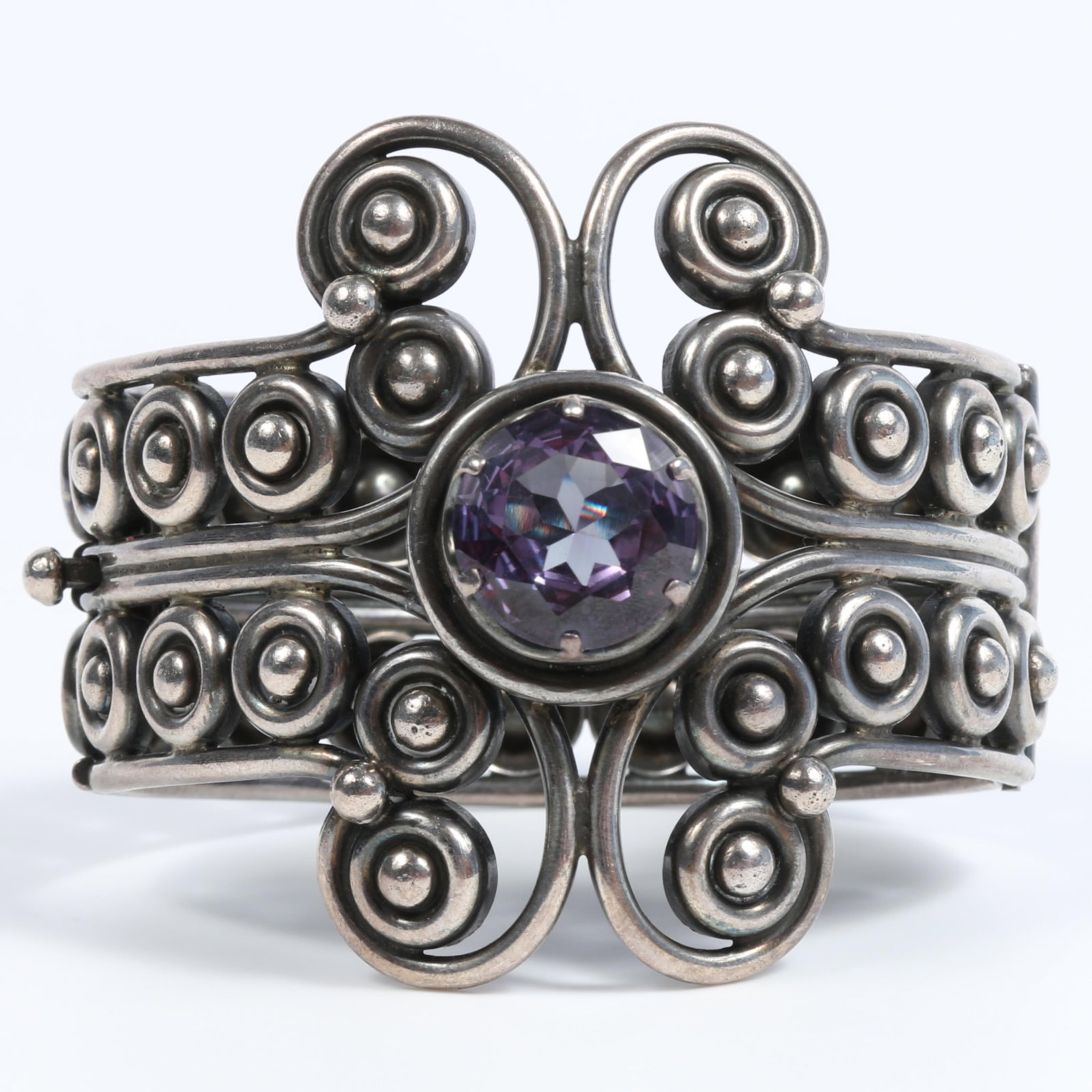 Vintage Los Ballesteros Mexican sterling silver hinged cuff bracelet with large faceted purple: Vintage Los Ballesteros Mexican sterling silver hinged cuff bracelet with large faceted purple alexandrite center stone 2 1/4"H x 2 1/2"Inner Diam.