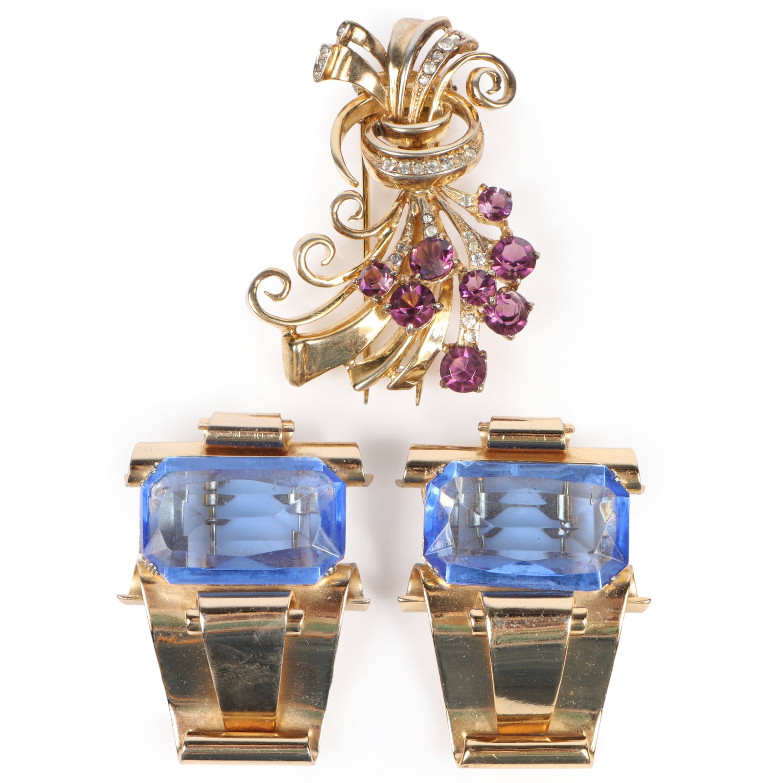 DeRosa retro sterling vermeil fur clip with amethyst jewels and rhinestone crystals and pair of: DeRosa retro sterling vermeil fur clip with amethyst jewels and rhinestone crystals and pair of unsigned Coro scroll design fur clips with large blue glass stones 2 1/2"H x 1 3/4"W (purple stone fur c
