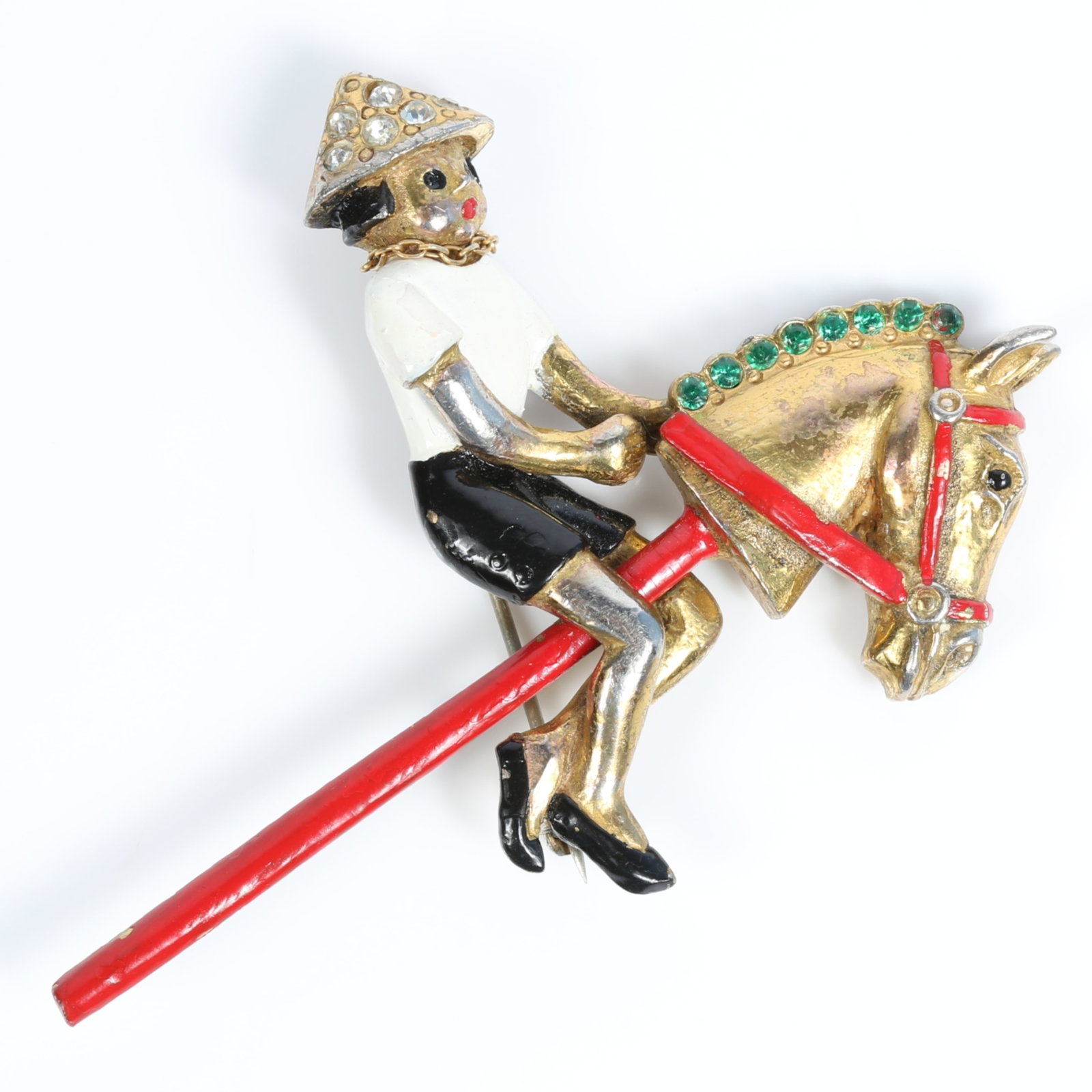 Retro enameled figural brooch with rhinestone detail, depicting an Asian child riding a toy stick: Retro enameled figural brooch with rhinestone detail, depicting an Asian child riding a toy stick horse wearing a tiny moveable chain necklace 2 1/4"H x 3"W