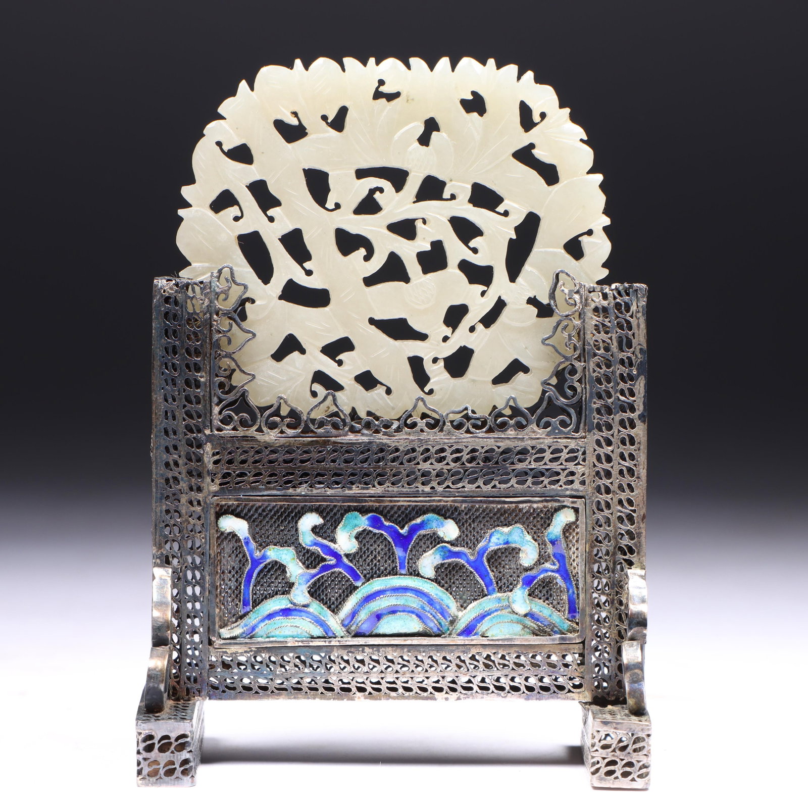 Chinese carved translucent white jade ornament, (mid 19th Century) mounted as table screen with: Chinese carved translucent white jade ornament, (mid 19th Century) mounted as table screen with cloisonne enamel waves, both sides, on sterling or silver filigree stand 3 3/4"H x 2 3/4"W