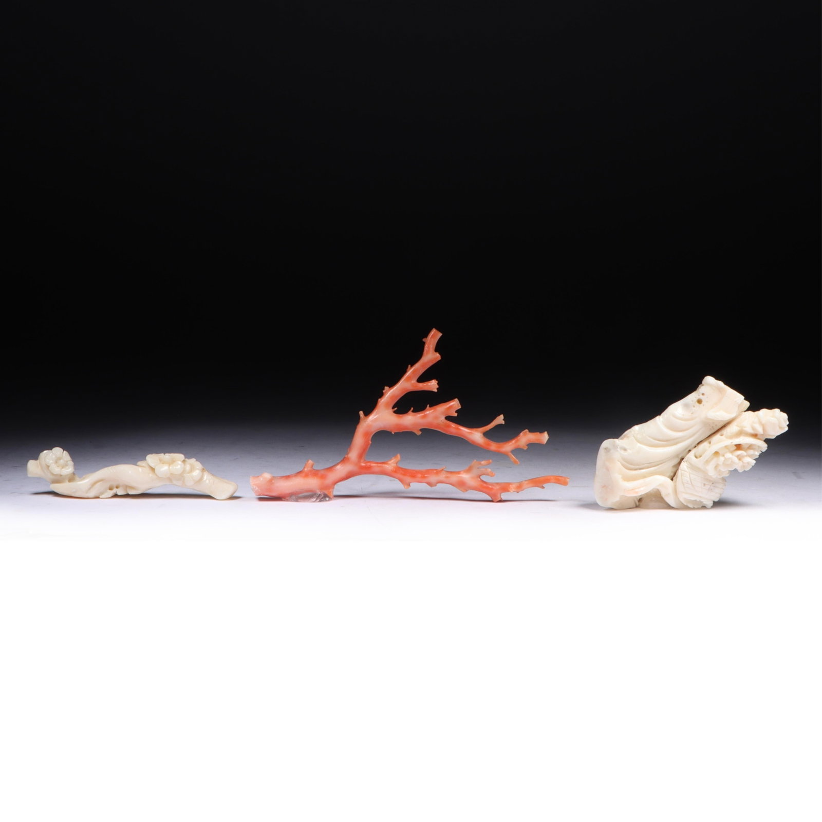 Three Chinese coral carvings: white and red coral branch, carved white coral flowering ornaments, (1 of 9)