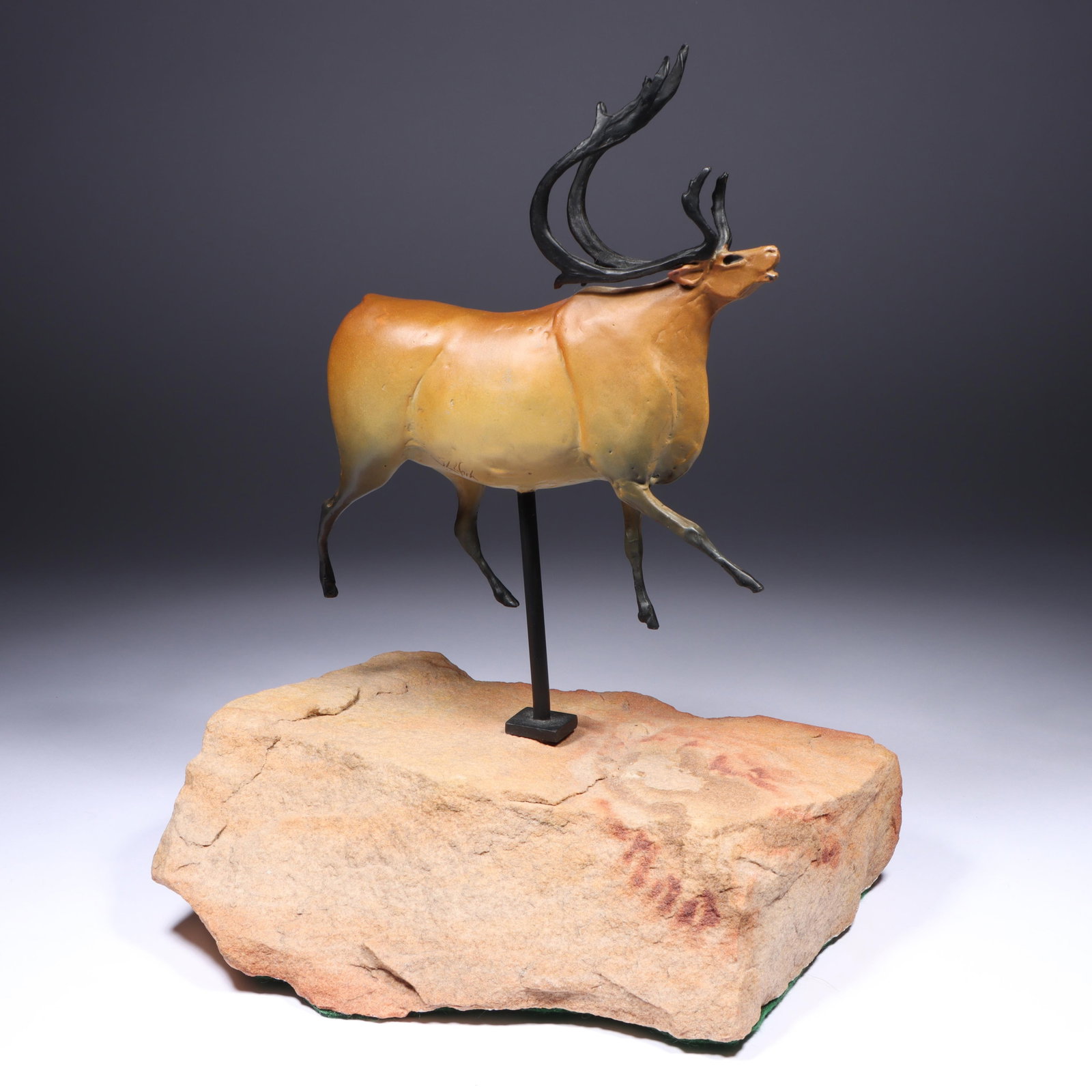 Star Liana York, American (b. 1952), caribou, bronze, 12"H x 9"W: Star Liana York American (b. 1952) caribou bronze mounted on natural stone base. Signed under belly, numbered 14/50. Minor paint loss on one side. Biography from the Archives of askART The following i