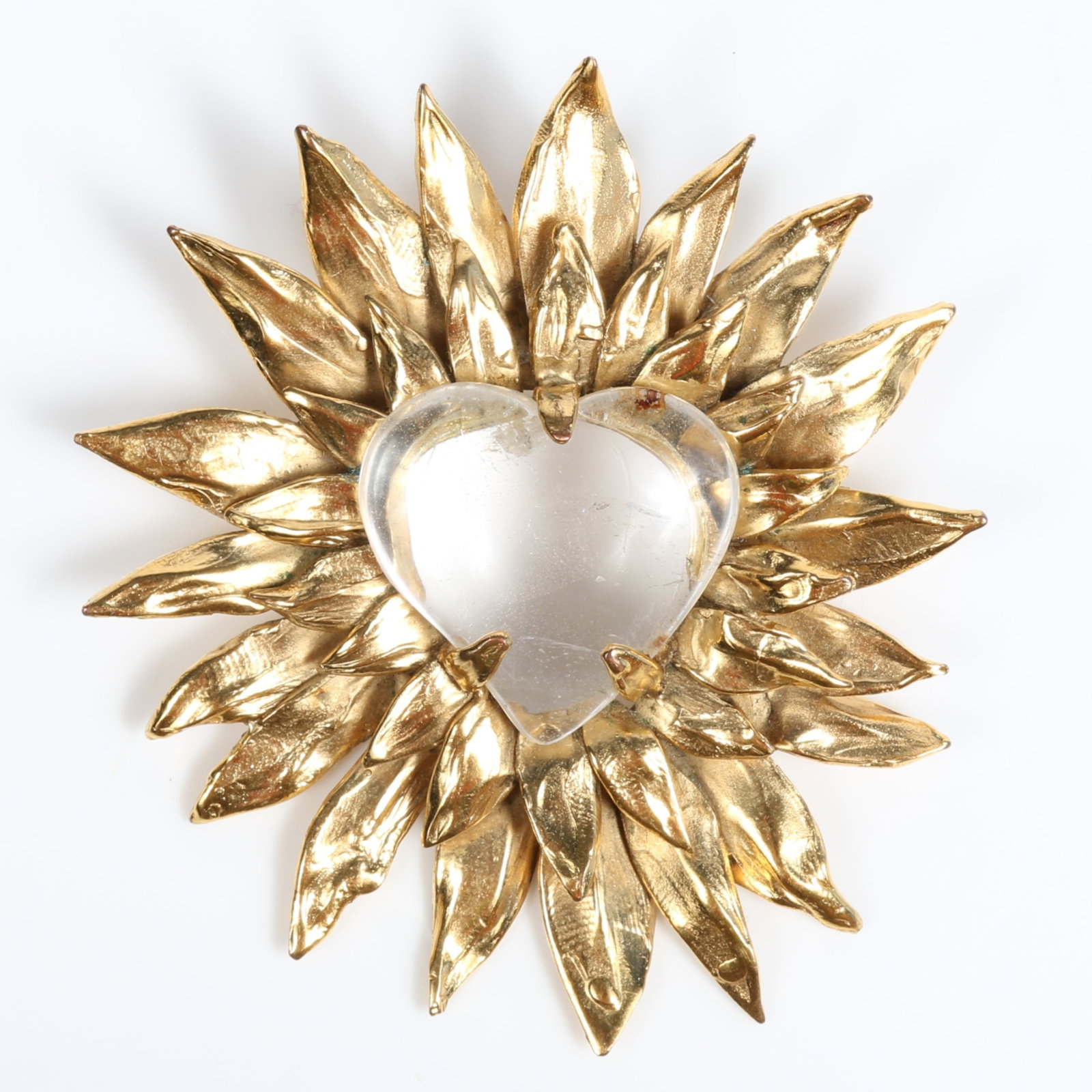 Robert Goossens Paris gold plated brooch with sunburst or "sacred heart" leaf pattern radiating from: Robert Goossens Paris gold plated brooch with sunburst or "sacred heart" leaf pattern radiating from a carved rock crystal heart center, possibly from the Coeur Pr?cieux collection Provenance: From th