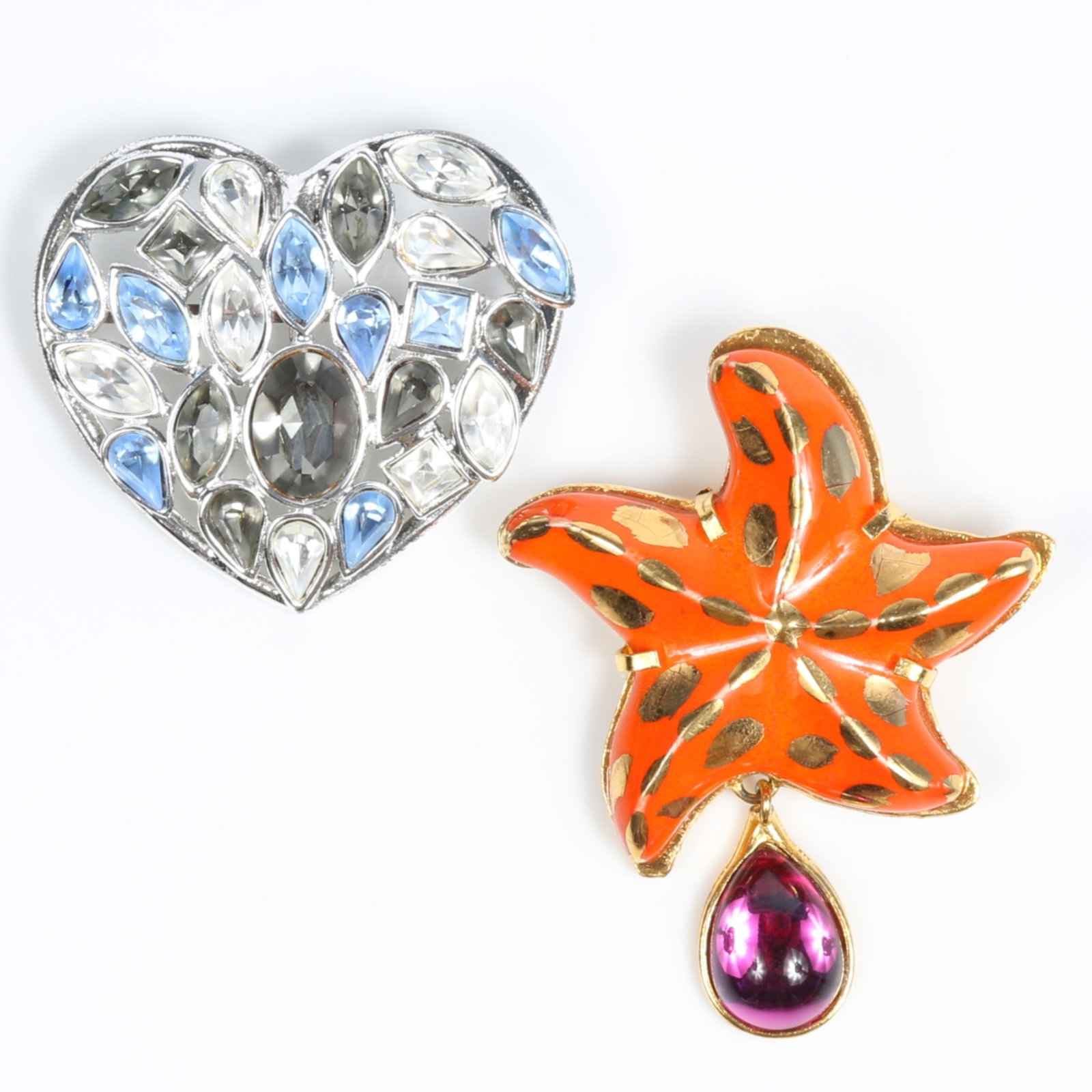Yves Saint Laurent YSL 2pc group: Rive Gauche ceramic starfish brooch with magenta jelly drop and: Yves Saint Laurent YSL 2pc group: Rive Gauche ceramic starfish brooch with magenta jelly drop and pastel blue and gray crystal heart pendant brooch Provenance: From the private collection of Dr. Claud