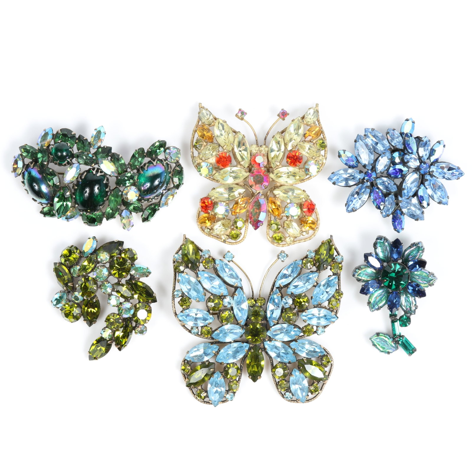 Regency 6pc brooch group including butterflies, floral, art glass cabochons, and AB rhinestone: Regency 6pc brooch group including butterflies, floral, art glass cabochons, and AB rhinestone crystals Provenance: From the private collection of Dr. Claudia Brodhead 2 5/8"W x 2 1/2"H (large green a