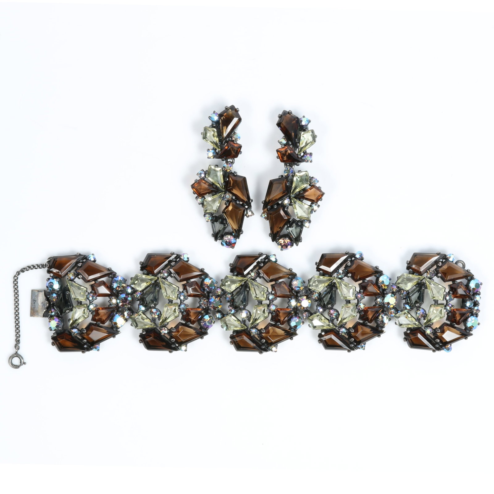 Schiaparelli smoky topaz rhinestone crystals and aurora borealis wide bracelet and matching drop: Schiaparelli smoky topaz rhinestone crystals and aurora borealis wide bracelet and matching drop earrings Provenance: From the private collection of Dr. Claudia Brodhead 7 3/4"L x 1 3/4"W