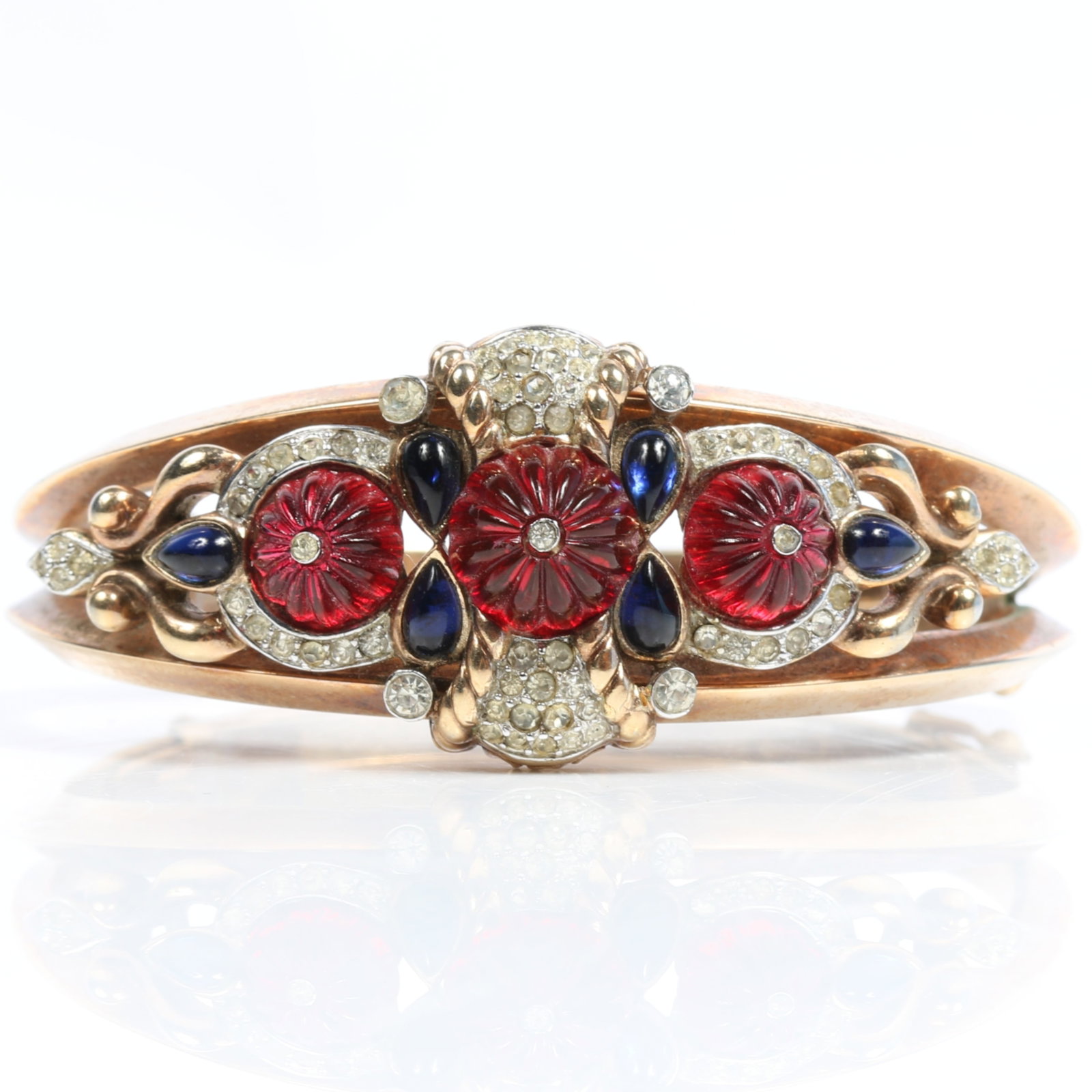 Trifari Alfred Philippe Moghul bangle bracelet with red rosette cabochons, pave, and blue pear shape: Trifari Alfred Philippe Moghul bangle bracelet with red rosette cabochons, pave, and blue pear shape cabochon jewels, book piece American Costume Jewelry Vol. 2 by Carla Ginelli Brunialti & Roberto Br