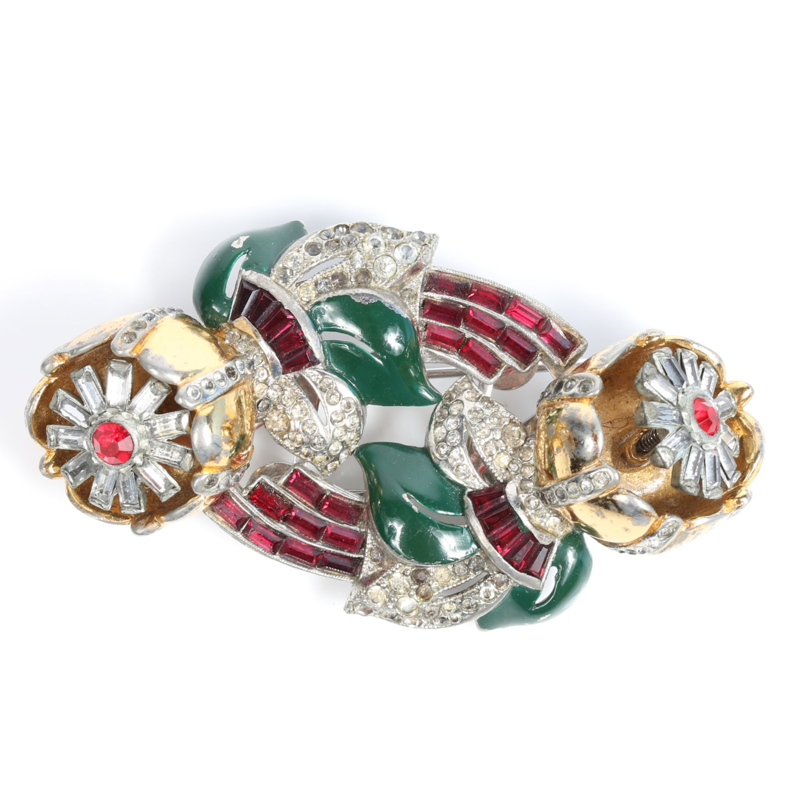 Coro Duette quivering camellias floral trembler brooch with red baguettes, pave, and green enamel: Coro Duette quivering camellias floral trembler brooch with red baguettes, pave, and green enamel leaves Several clear rhinestones missing Provenance: From the private collection of Dr. Claudia Brodhe