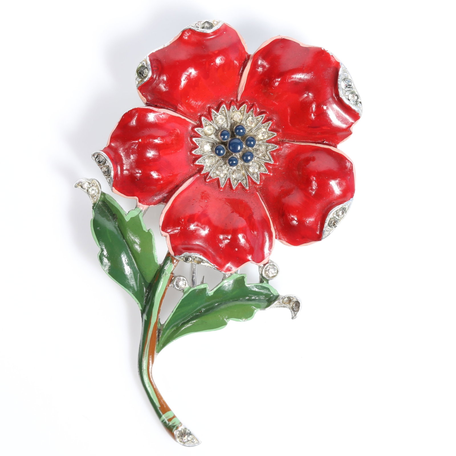 Trifari Alfred Philippe 1940 "Poppy" red and green enamel book piece fur clip with pave rhinestones: Trifari Alfred Philippe 1940 "Poppy" red and green enamel book piece fur clip with pave rhinestones Several missing rhinestones. American Costume Jewelry Vol. 2 by Carla Ginelli Brunialti & Roberto Br