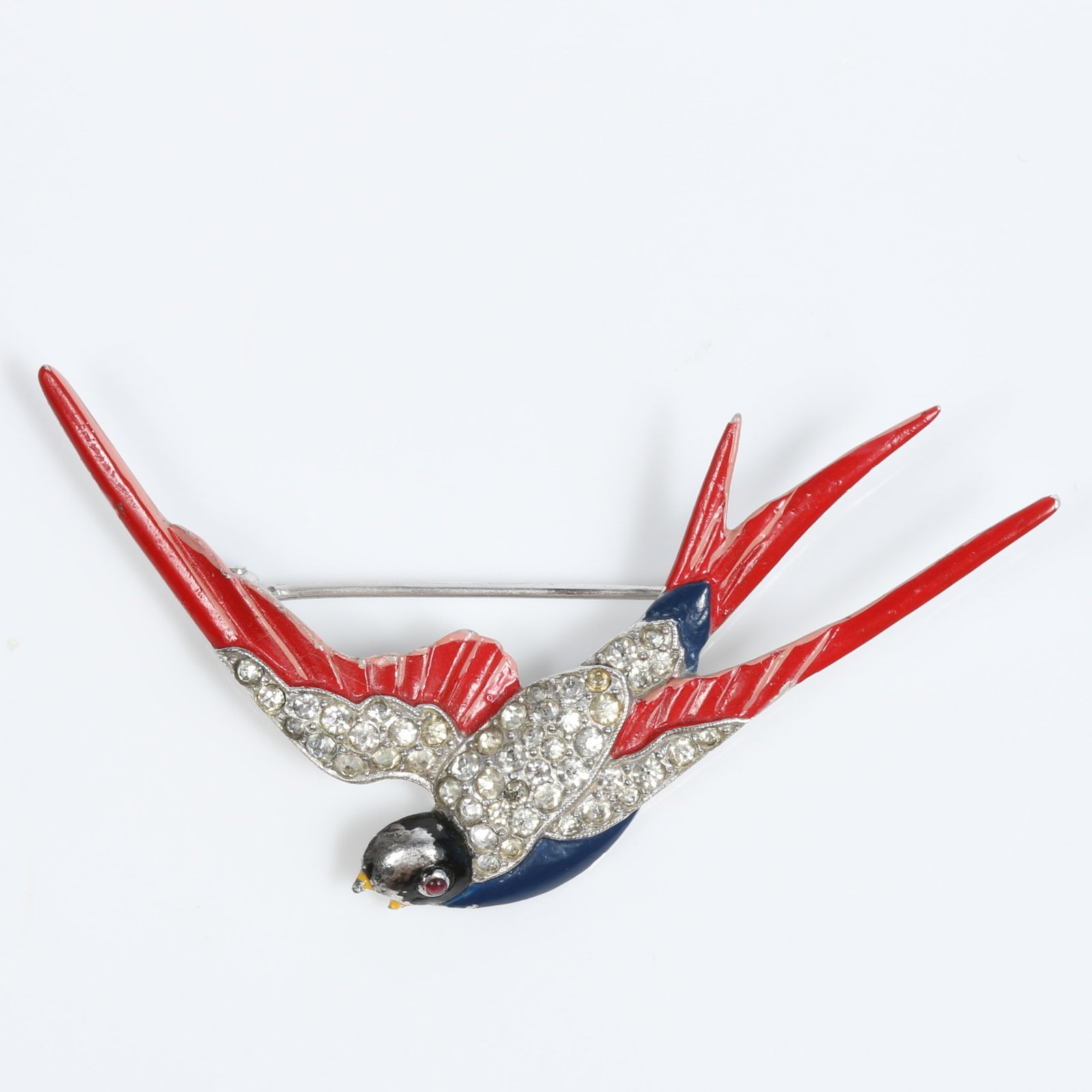 Trifari 'Alfred Philippe' WWII patriotic sparrow or swallow bird in flight brooch with enamel and: Trifari 'Alfred Philippe' WWII patriotic sparrow or swallow bird in flight brooch with enamel and pave rhinestones There is some wear to the enamel. Provenance: From the private collection of Dr. Clau