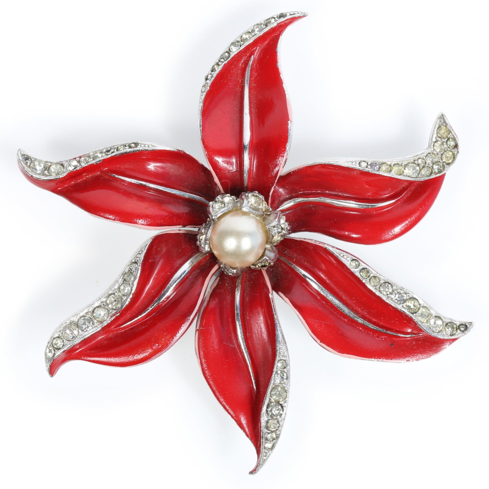 Trifari Alfred Philippe poinsettia red enameled flower brooch with pave rhinestones and faux pearl: Trifari Alfred Philippe poinsettia red enameled flower brooch with pave rhinestones and faux pearl center Provenance: From the private collection of Dr. Claudia Brodhead 2 3/4"H x 2 3/4"W